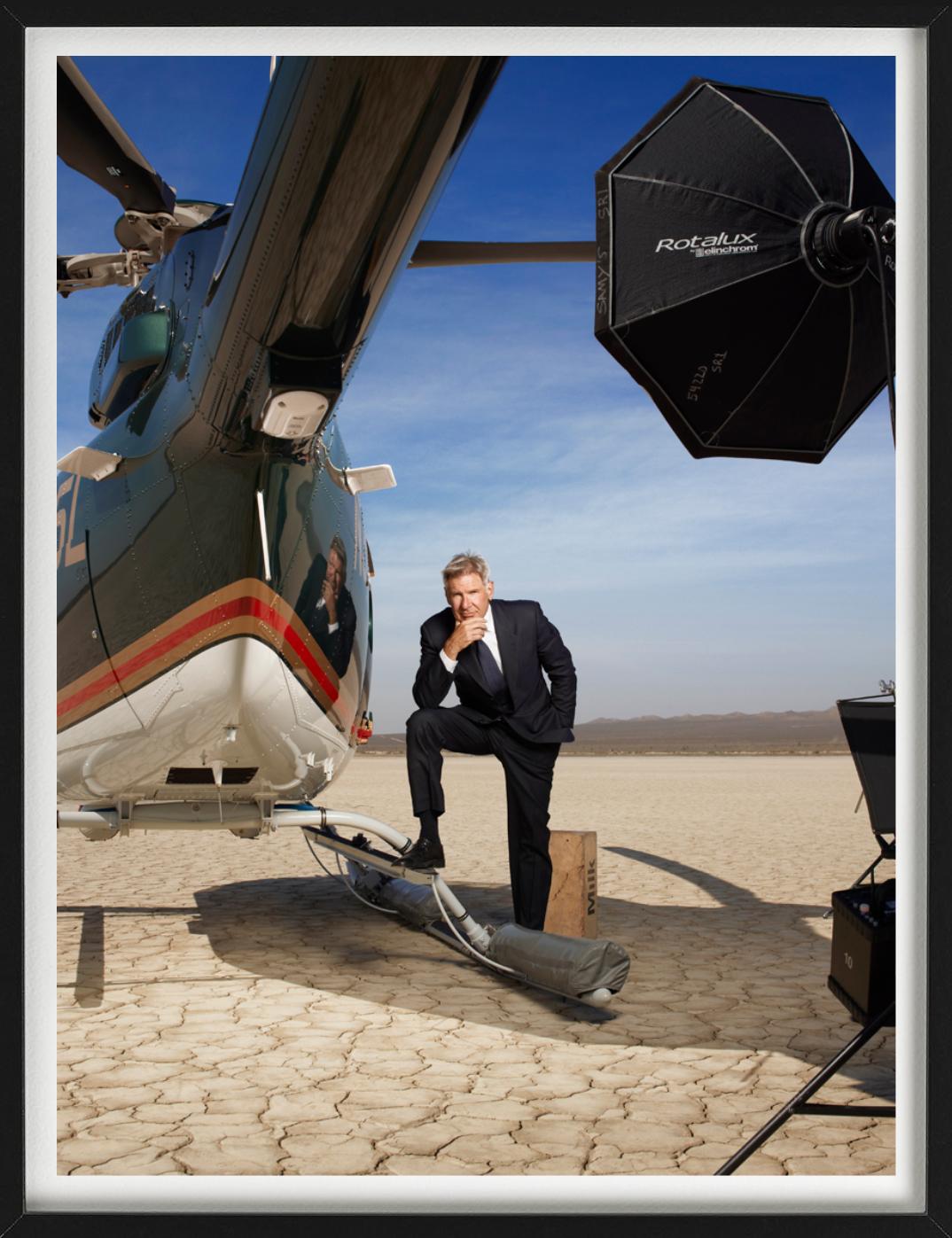 Harrison Ford, standing next to a helicopter, by Timothy White.

All prints are limited edition. Available in multiple sizes. High-end framing on request.

All prints are done and signed by the artist. The collector receives an additional