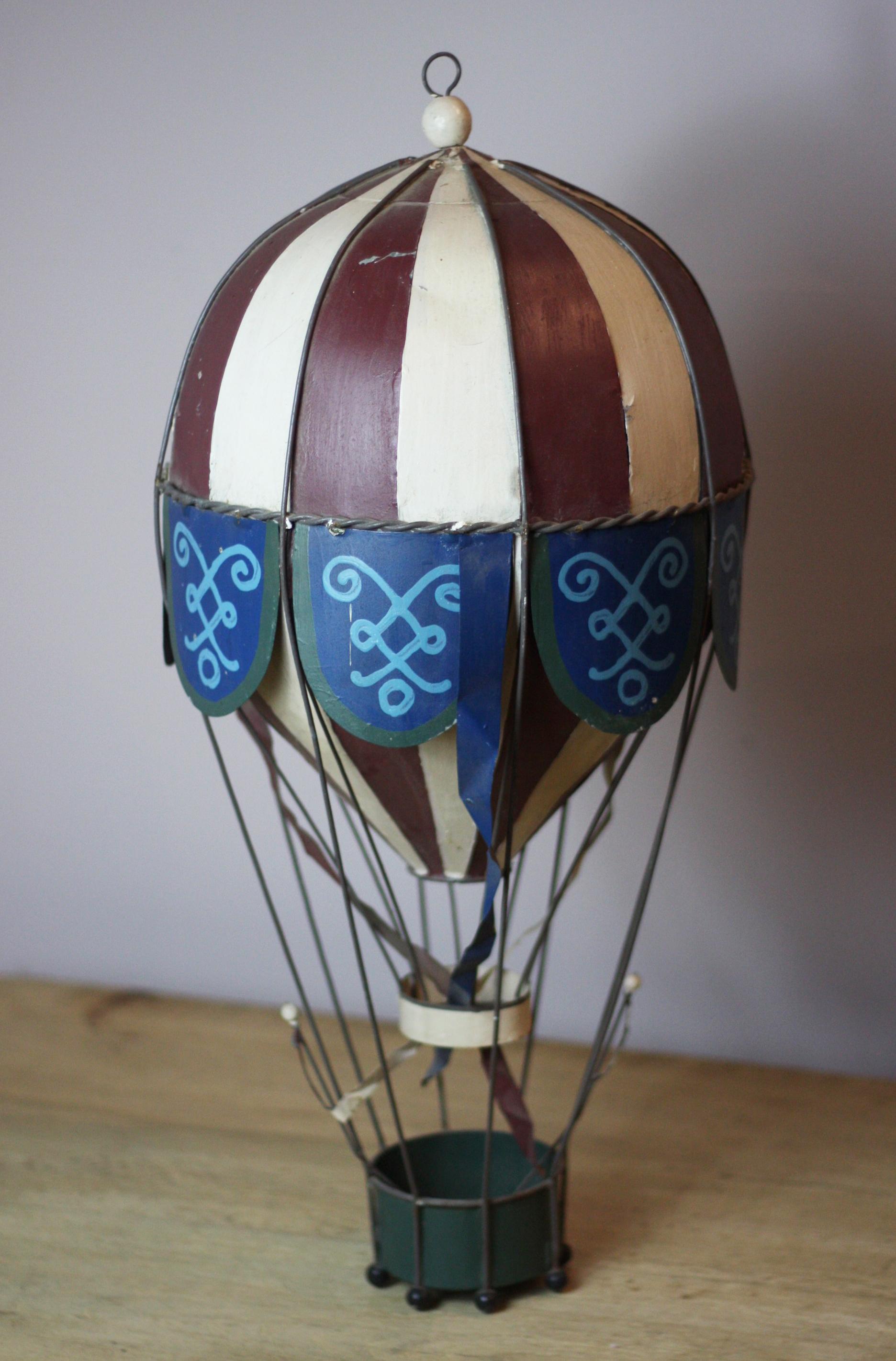 Fun and decorative brightly painted tin hot air balloon model, circa 1910.