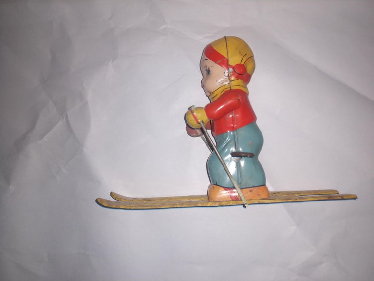 Mid Century Tin Litho Windup Toy Skier Girl by Chein C1945 In Good Condition For Sale In Port Jervis, NY