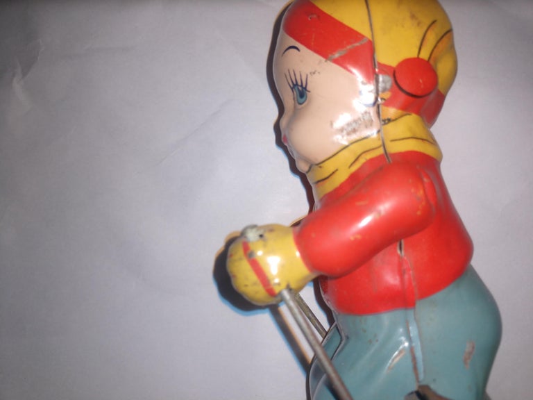 Mid-20th Century Mid Century Tin Litho Windup Toy Skier Girl by Chein C1945 For Sale