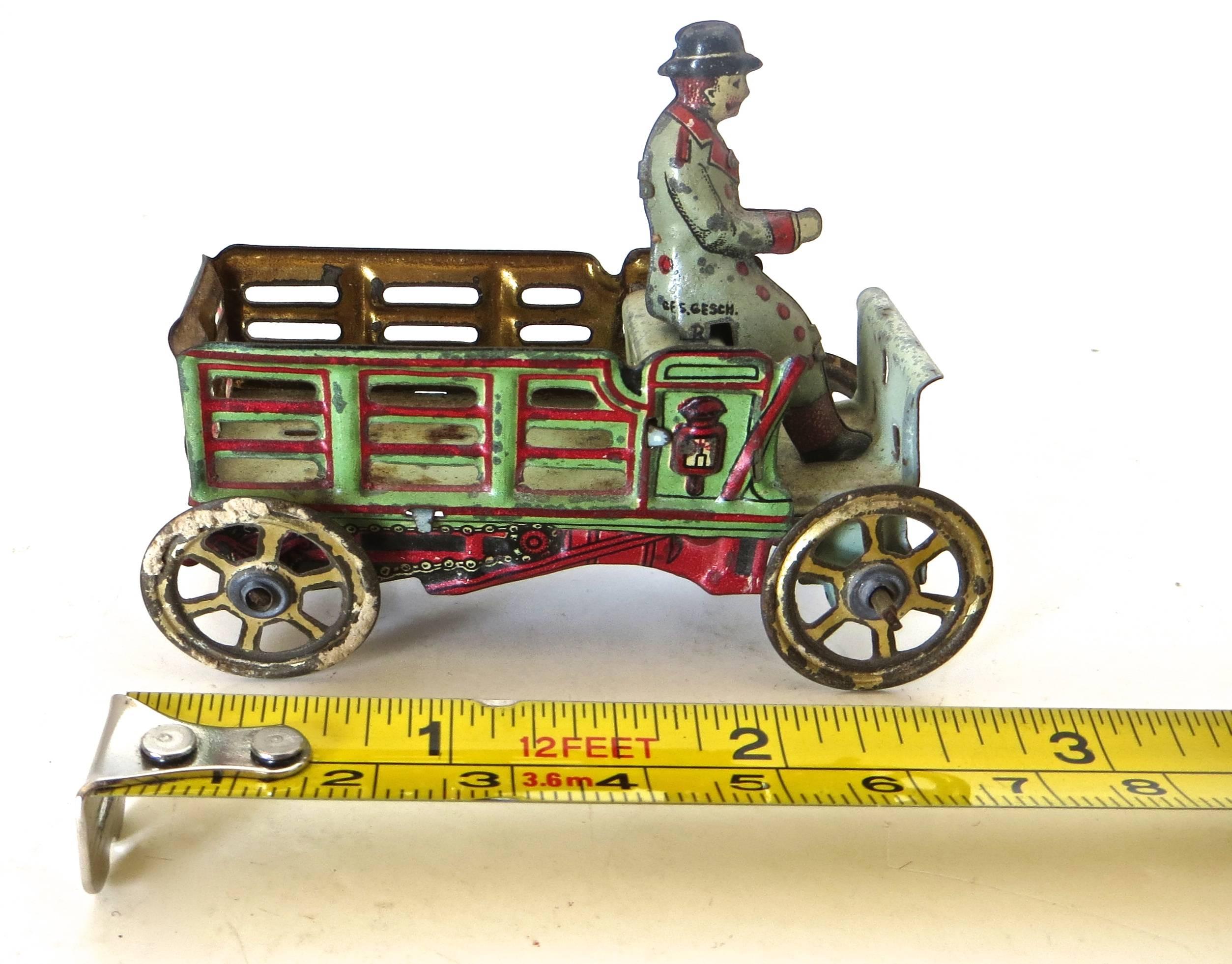 Tin Penny Toy 'Diminutive' Open Stake Truck with Driver, German, circa 1900 1