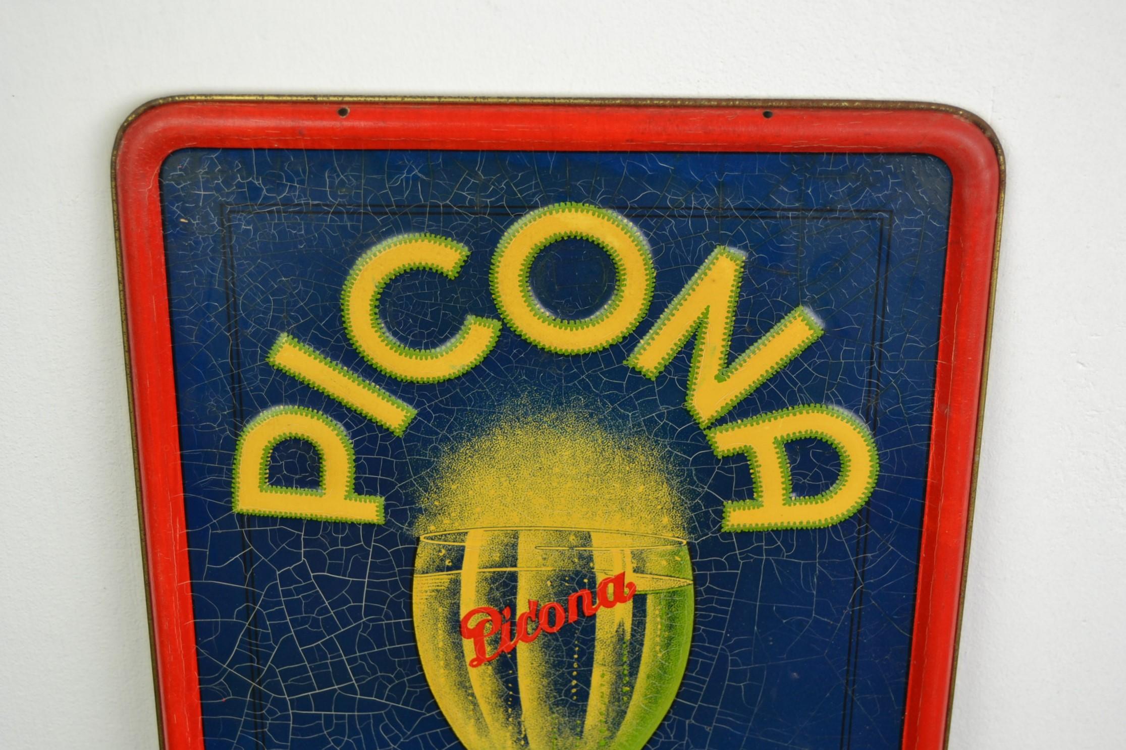 Vintage tin sign for lemonade from the 1930s. 
It's a blue sign with a sparkling glass of Picona lemonade. With red border and embossed yellow lettering. 
This sign for orange and limon lemonade is dated 1934 and made by Rob Otten, Belgium.
It
