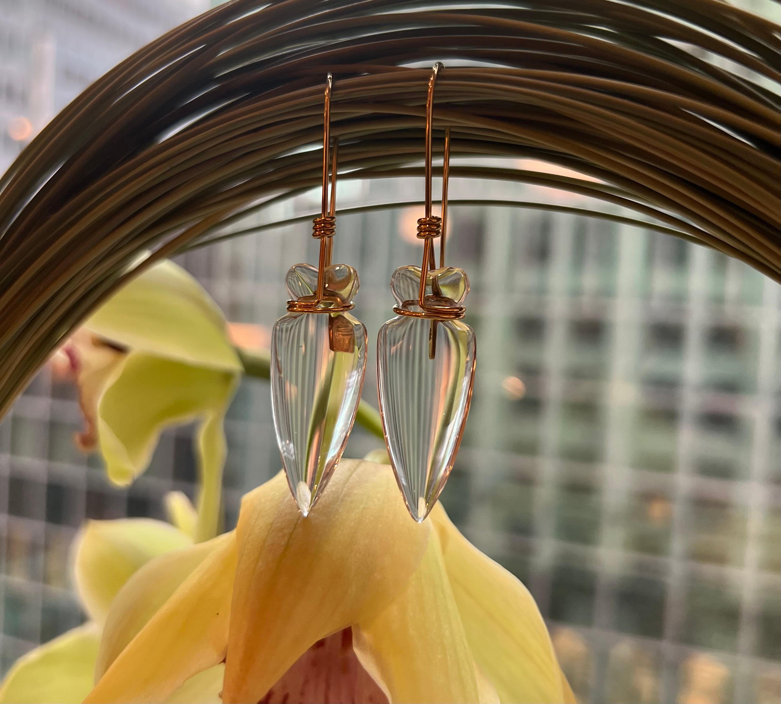 A pair of rock crystal and 18 karat gold Amphora earrings by Tina Chow. Signed Tina Chow, stamped 750 on wire and on gold rectangular tag. Hook earrings.

Tina Chow's work has a signifiant following and has become increasingly hard to find. The