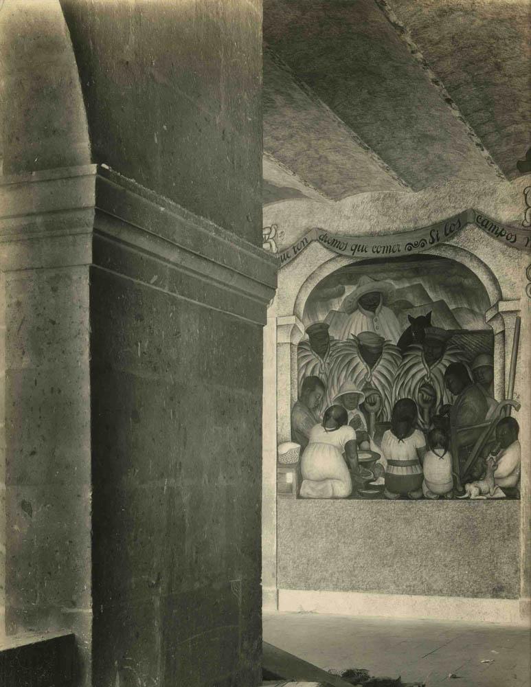 An original 1920s silver gelatin print by photographer Tina Modotti, showing a fresco in the Secretariat of Education in Mexico City by artist Diego Rivera.  Photo is stamped “Photographs-Tina Modotti Mexico, D.F.” on reverse.  Archivally matted to