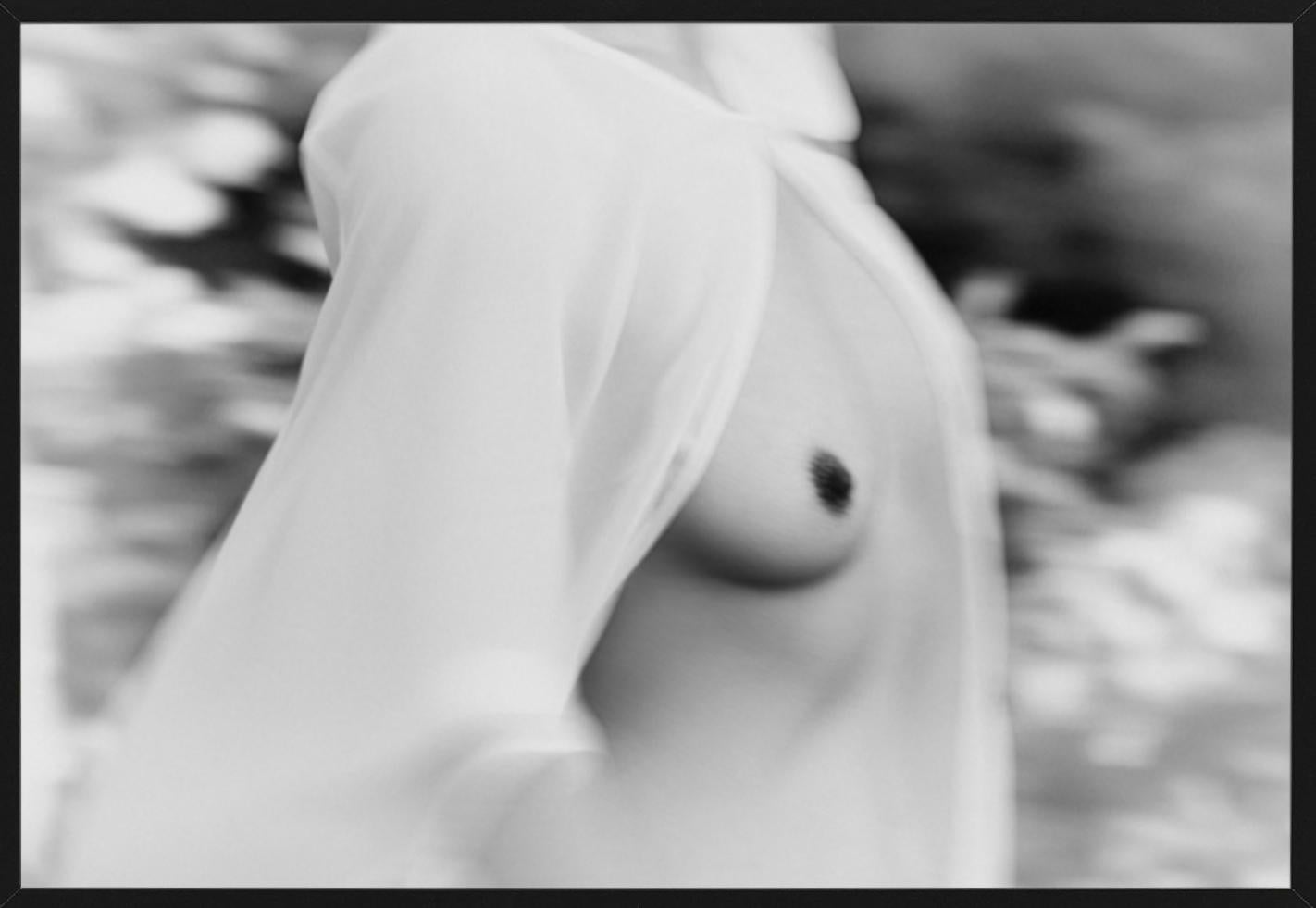 Judith - black and white nude showing exposed breasts under a white silk blouse - Photograph by Tina Trumpp