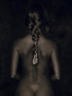 Nu de Dos - female nude from behind with cord in braided hari sitting