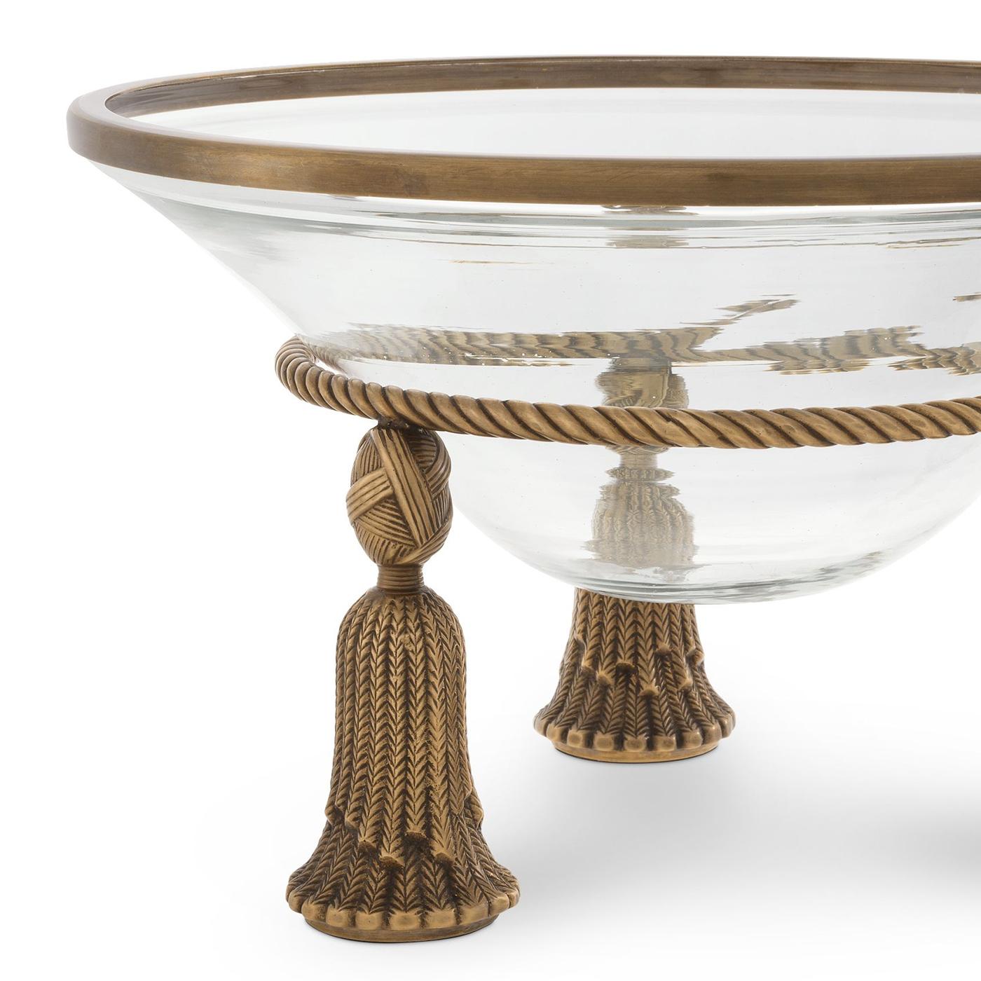 Bowl Tino with clear glass bowl and with
structure and deco in solid brass in old finish.