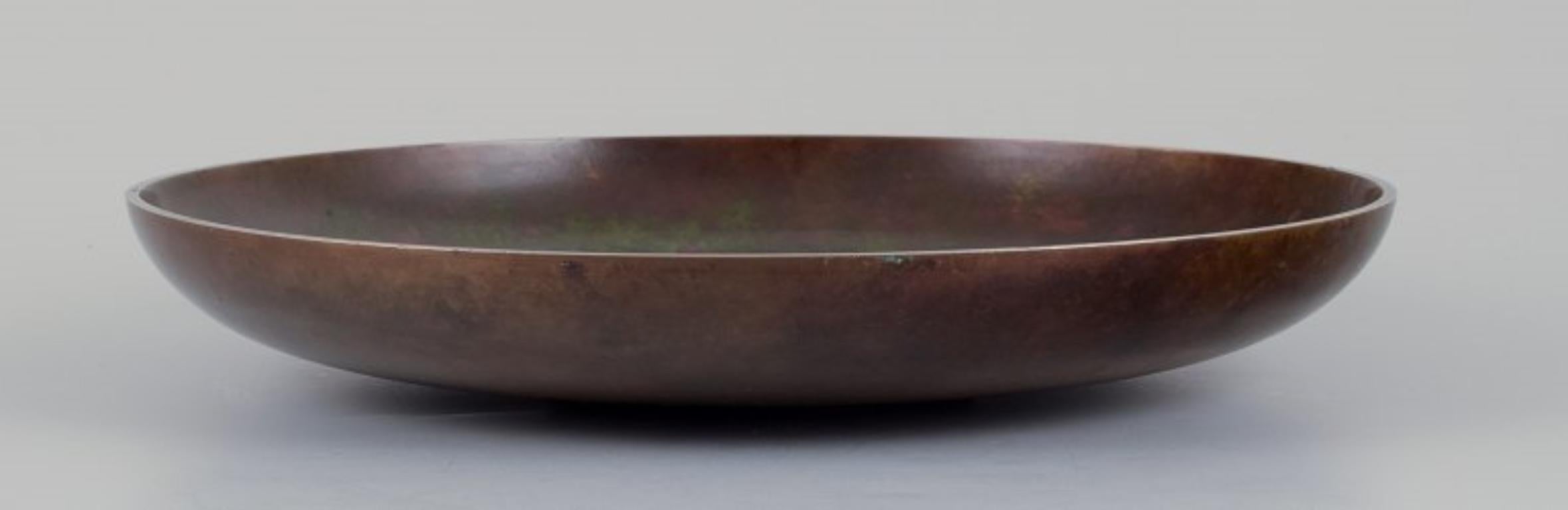 Danish Tinos, Denmark. Large Art Deco bronze bowl with a nude woman. Mid-20th C. For Sale