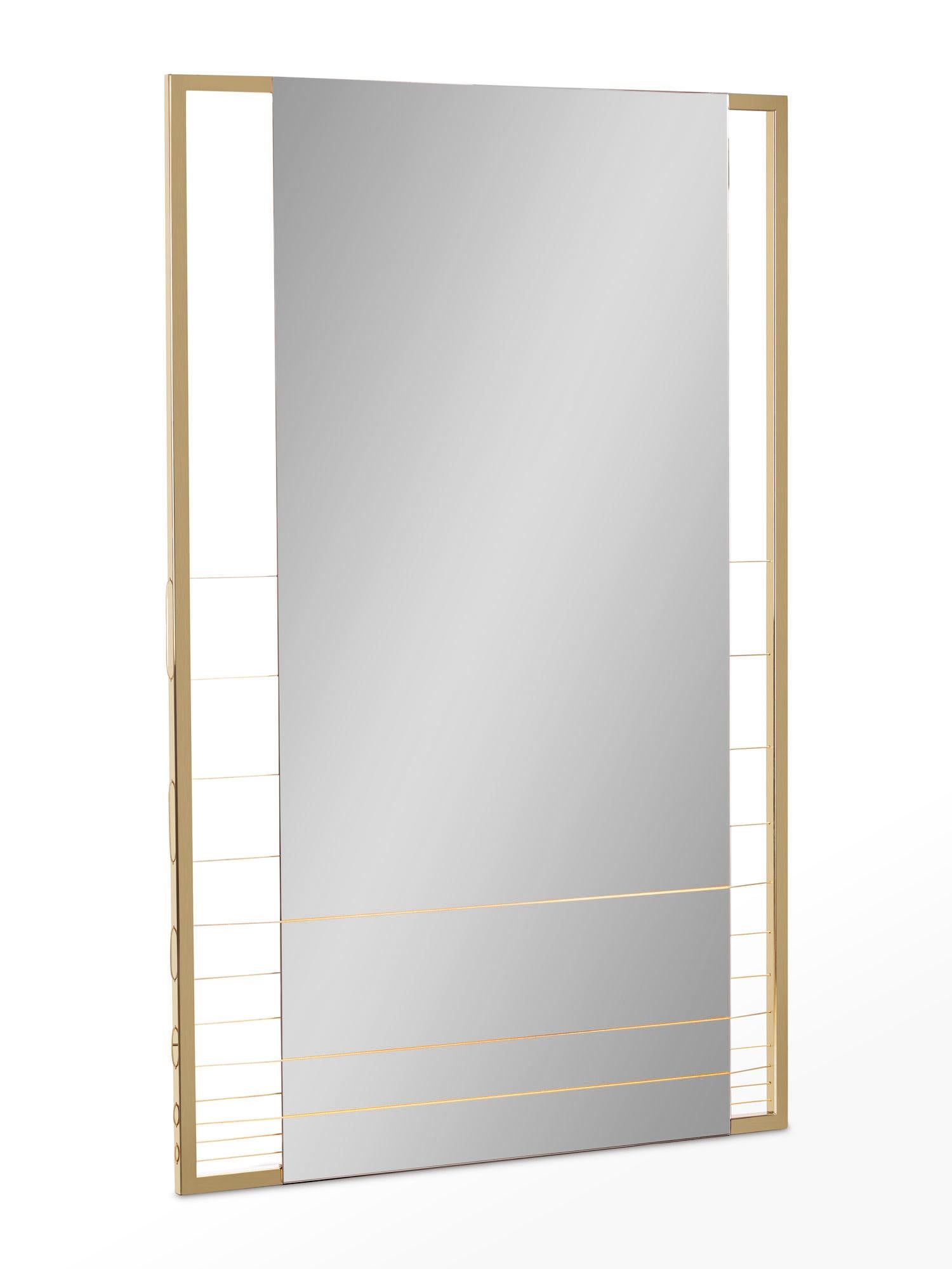 Aegis-M mirror is made to order using gold finish stainless steel frame, tinted mirror and gold steel wire. The mirror can be hung vertically or horizontally. A modern contemporary design using only the finest materials and manufacturing methods.
