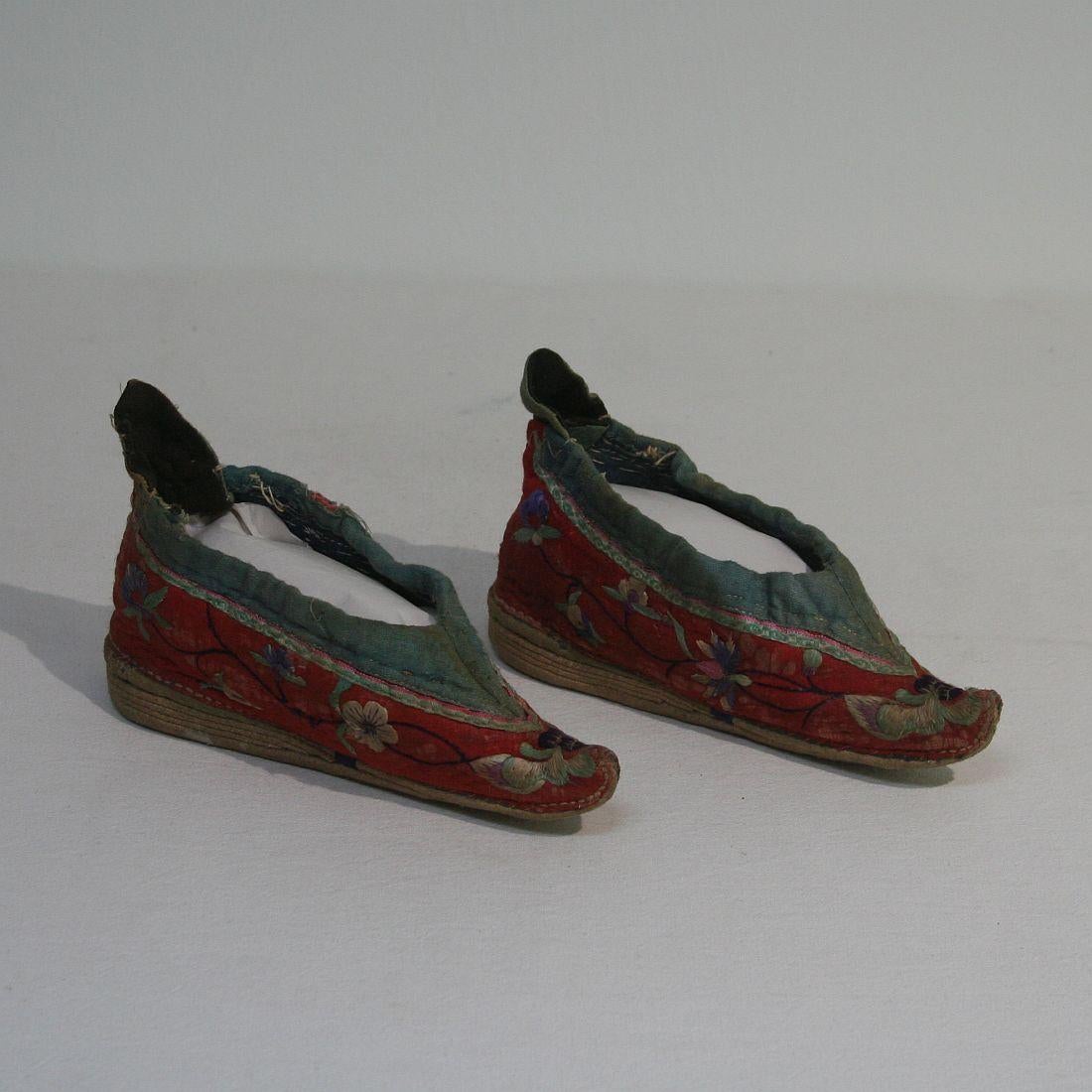 Very rare tiny 19th century Chinese embroidered women’s shoes, China, 19th century. Weathered.