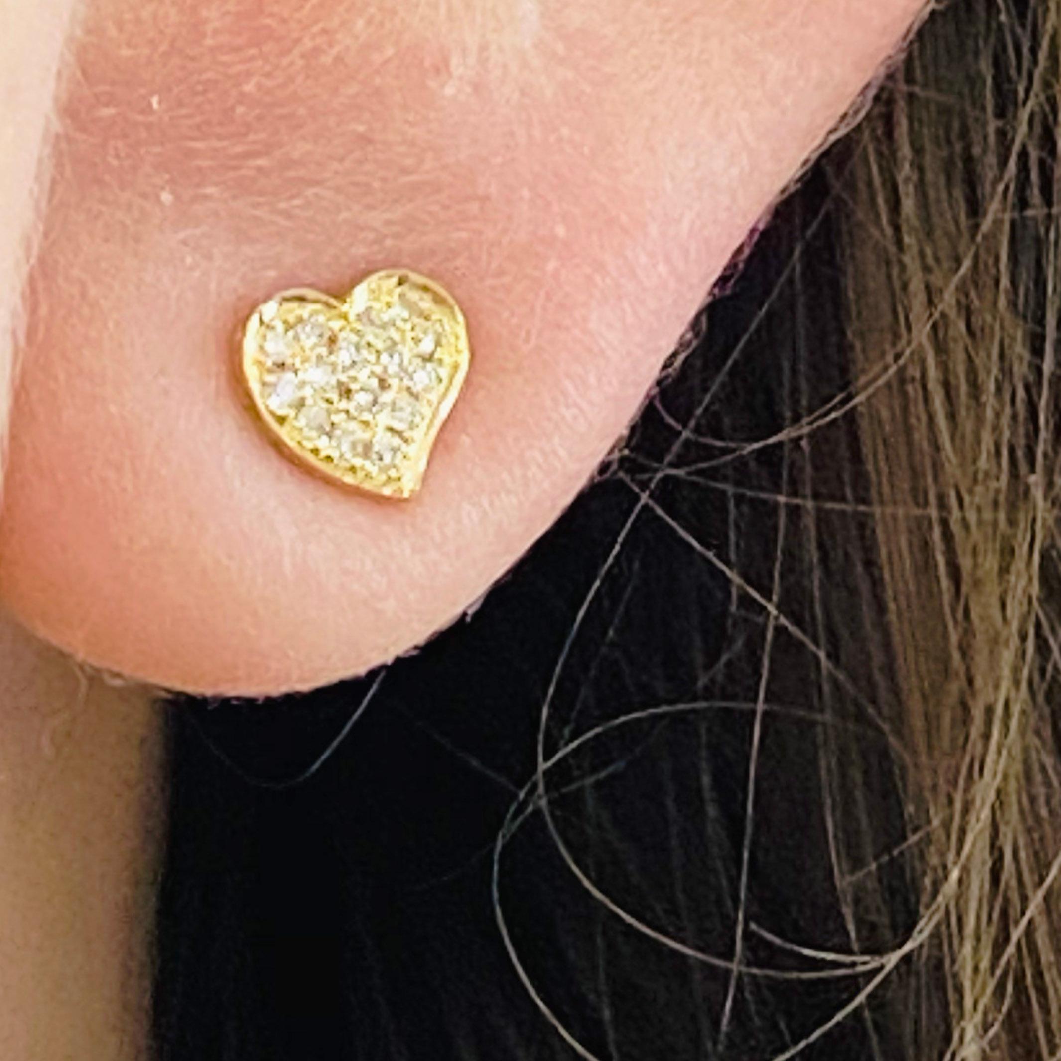 These sweet little heart studs look great on any ear, adding a touch of whimsy and sweet charm. Pave diamond studs are both trendy and classic. These diamond heart earrings are a great staple to add to your collection, or to your loved one's