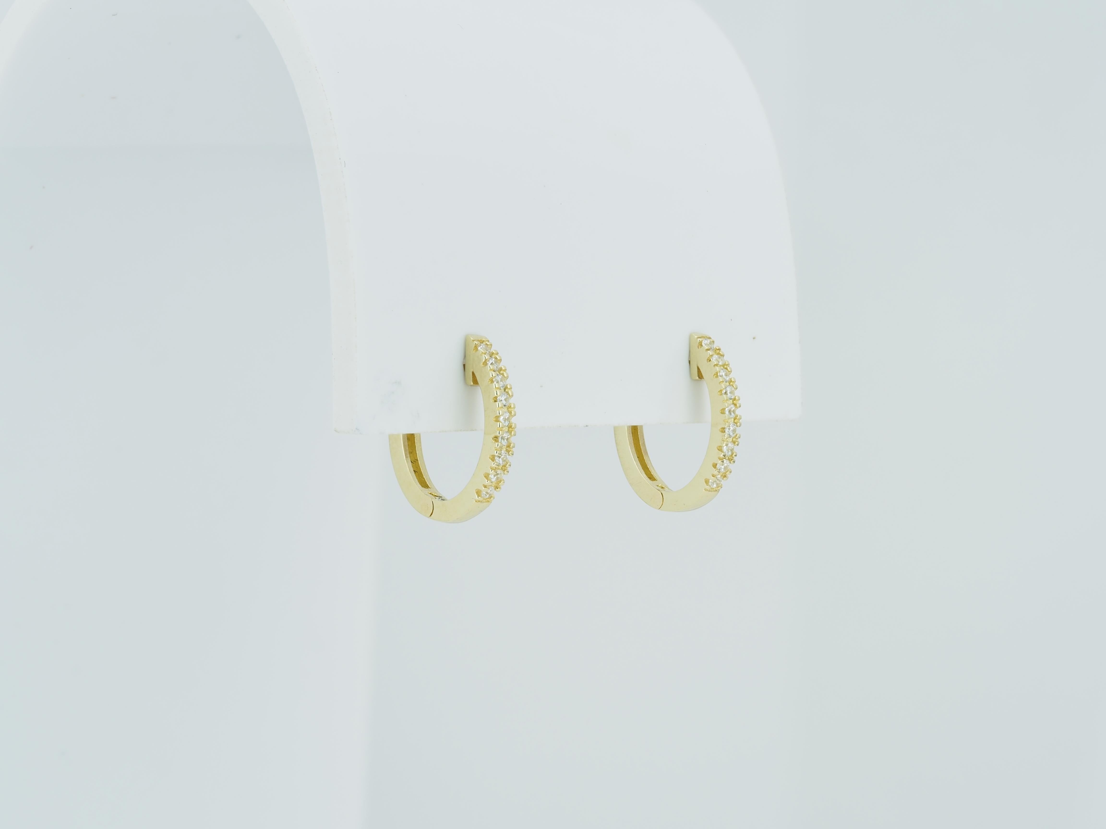 Contemporary Tiny Huggie Hoop Earrings in 14 Karat Yellow Gold For Sale