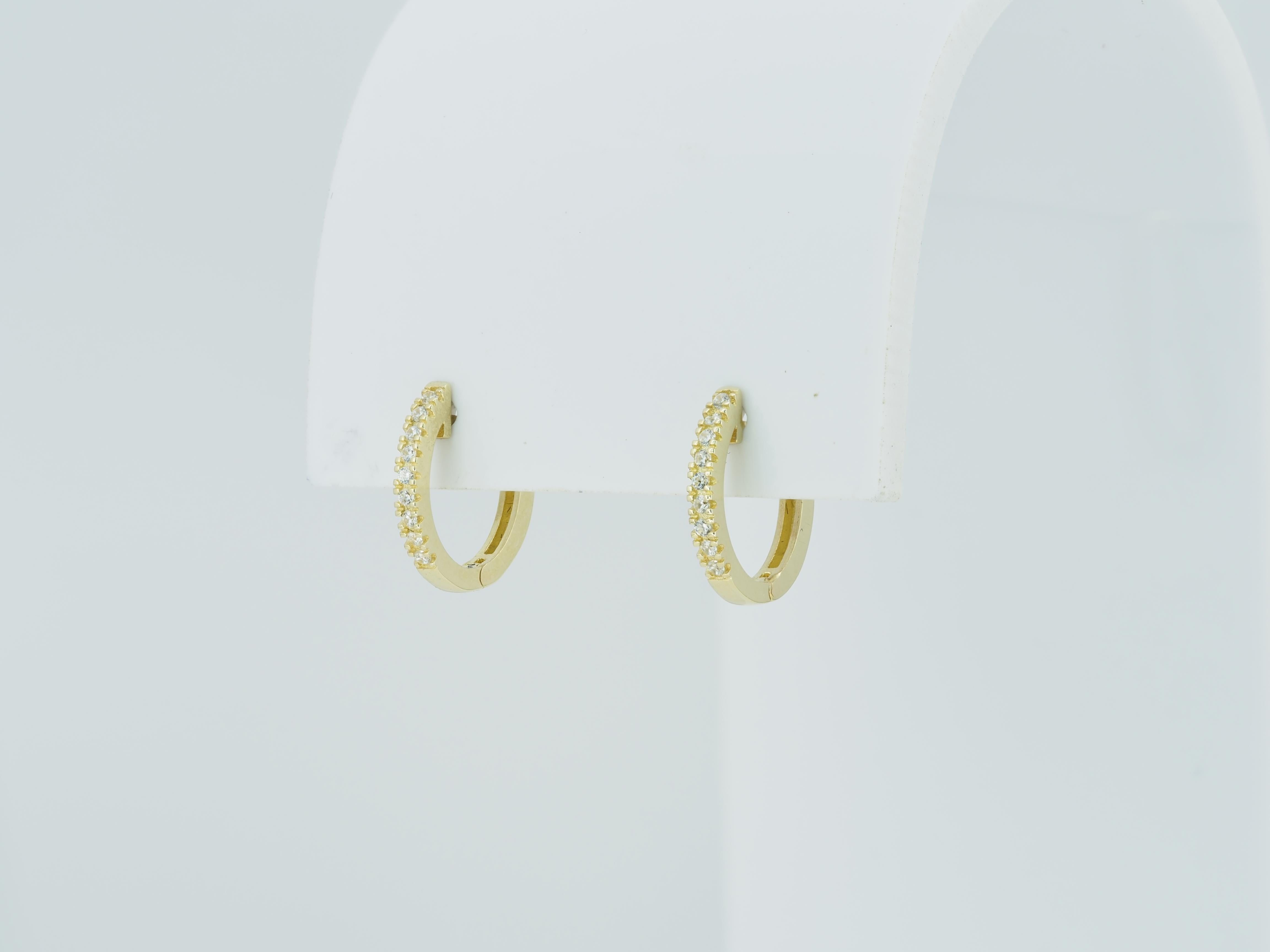 Contemporary Tiny Huggie Hoop Earrings in 14 Karat Yellow Gold. For Sale