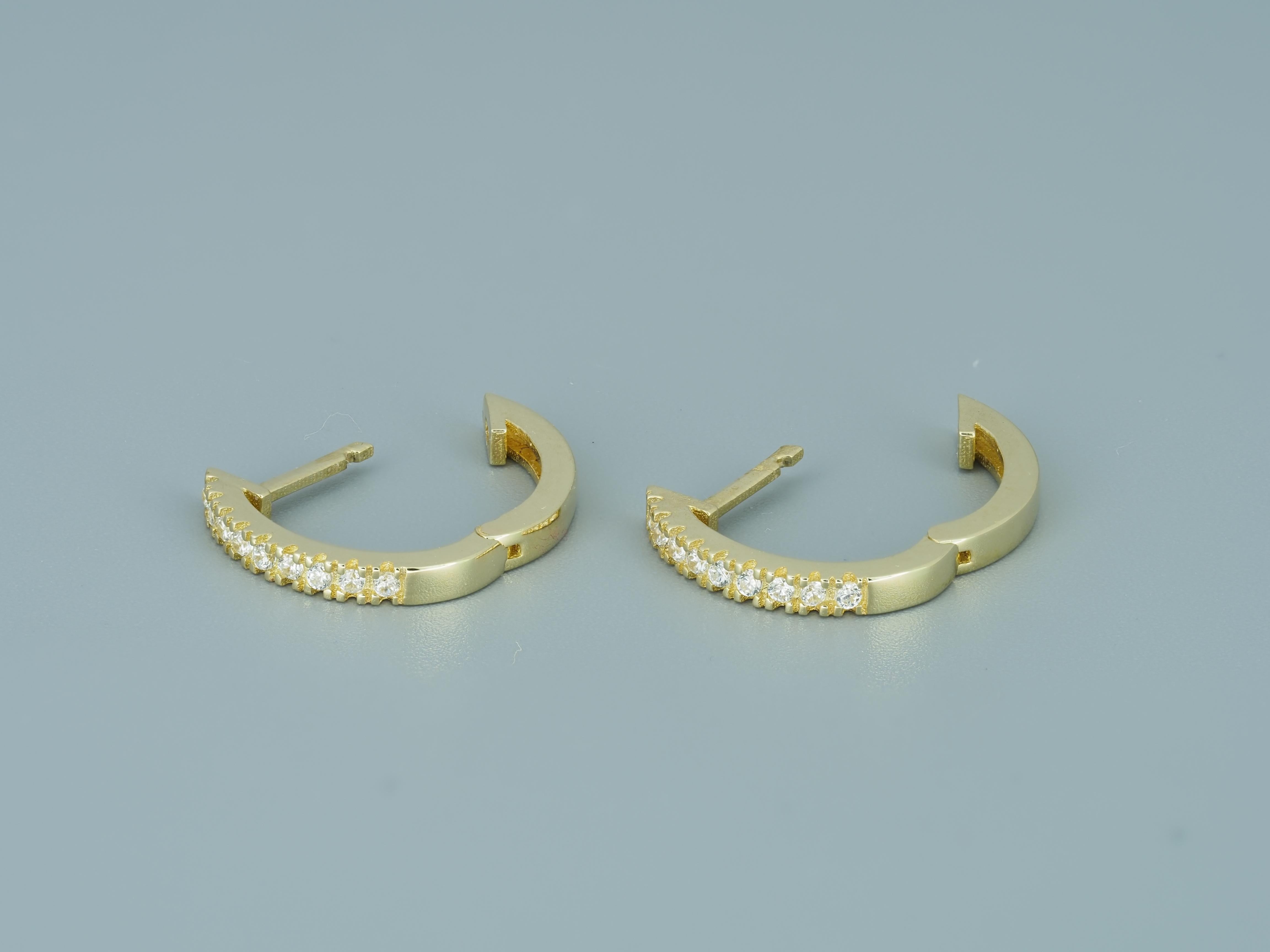 Tiny Huggie Hoop Earrings in 14 Karat Yellow Gold.  For Sale 1