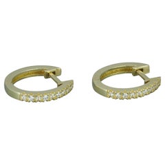 Boucles d'oreilles cerceau Tiny Huggie en or jaune 14 carats