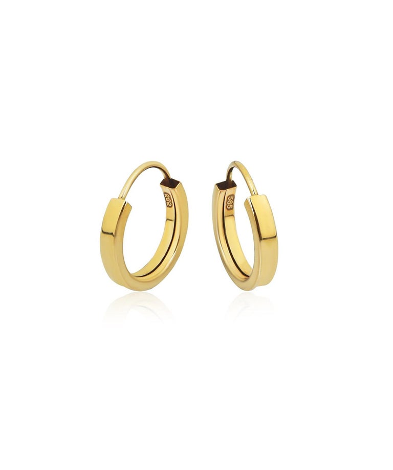 Tiny Huggie Hoop Earrings in 14 karat yellow gold. Huggie hoop gold earrings. In New Condition For Sale In Istanbul, TR