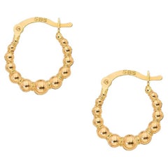 Tiny Huggie Hoop Earrings in 14 Karat Yellow Gold. Huggie Hoop Gold Earrings