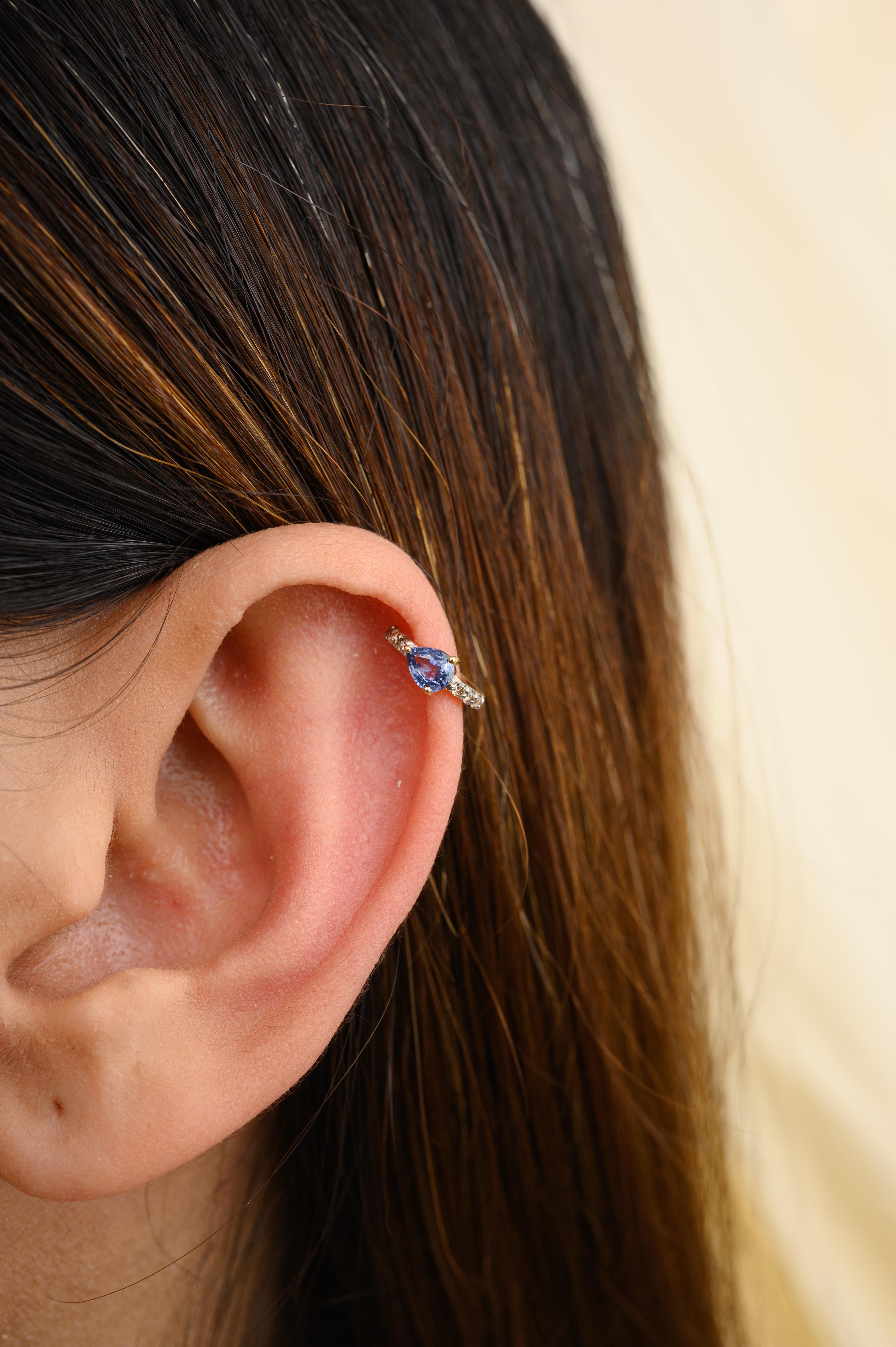 Winzige Helix-Ohrringe aus 18 Karat Gold mit blauem Saphir und Diamanten, die Ihren Look unterstreichen. Sie brauchen Helix-Ohrringe, um mit Ihrem Look ein Statement zu setzen. Diese Ohrringe mit rund geschliffenen Saphiren sorgen für einen
