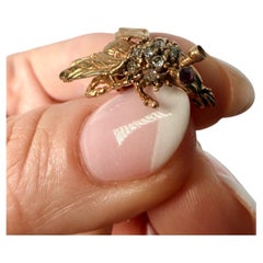 Spilla con rubino e diamante in oro giallo 14KT