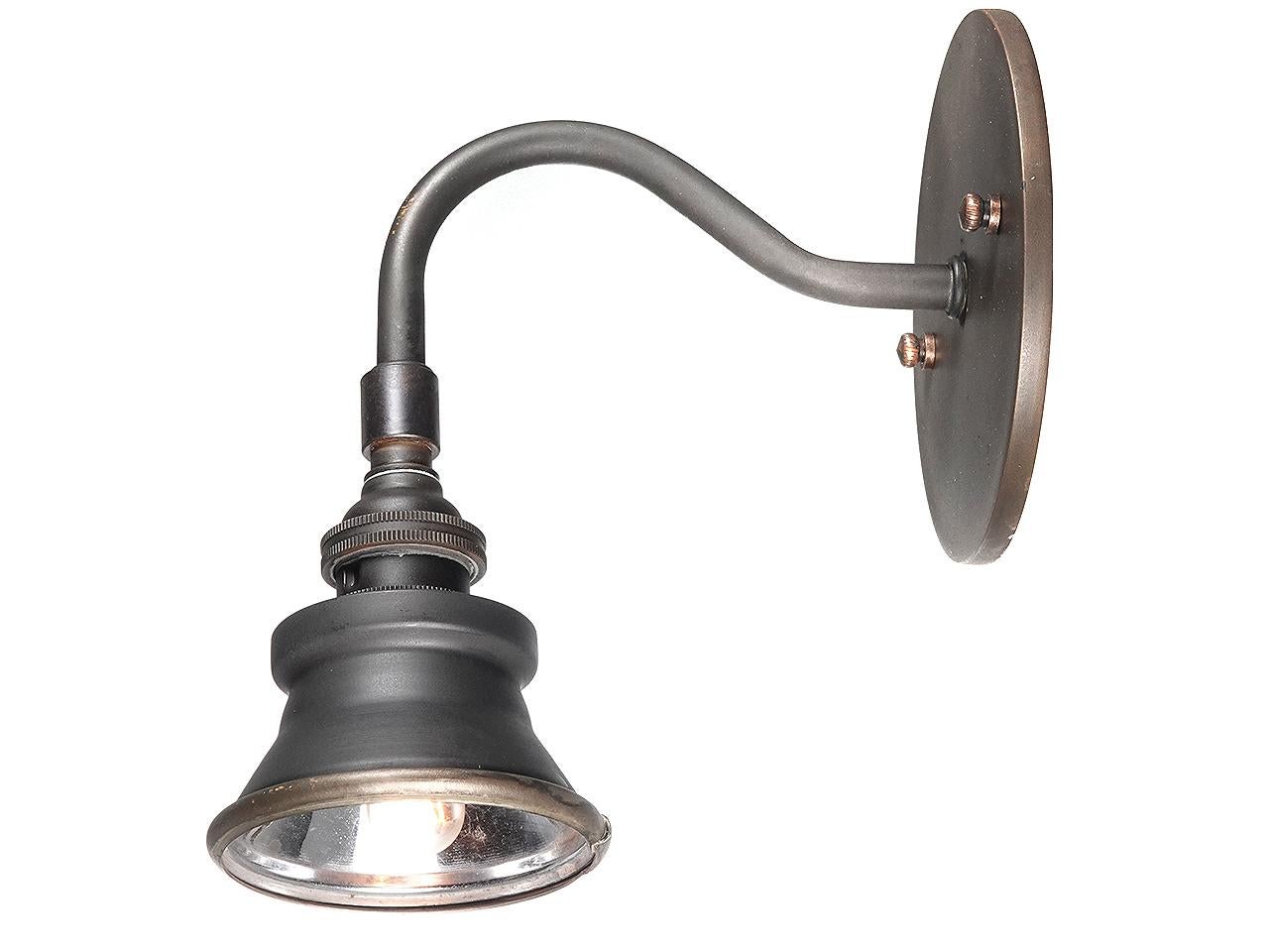 These sconces have the smallest of shades. The early shades are copper with a silvered interior and date to the 1920s. The arm, wall plate and candelabra socket were fabricated by us to create this unique wall lamp. The lamps have a simple clean