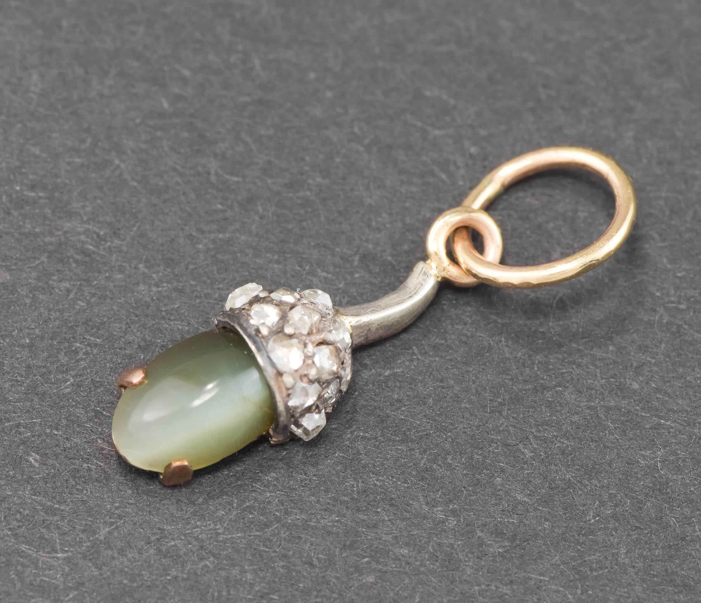 
Dainty, elegant and beautifully made, this Victorian era diamond and chrysoberyl acorn was originally part of a cravat pin; I have converted it into a wonderful charm pendant.  (Acorns have symbolized strength, potential, immortality and fertility