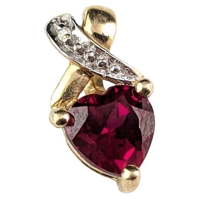https://a.1stdibscdn.com/tiny-vintage-synthetic-ruby-and-diamond-heart-pendant-9k-gold-for-sale/j_23462/j_201901021692997214366/j_20190102_1692997214536_bg_processed.jpg?width=768