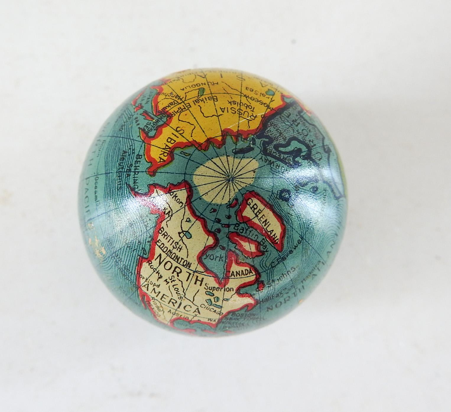Circa 1930's lithographed small pencil sharpener in the shape of a world globe. New old stock, have several of these, slight color variations, surface scratches.