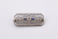 Tiny White Gold Art Deco brooch with Diamond and Sapphires.