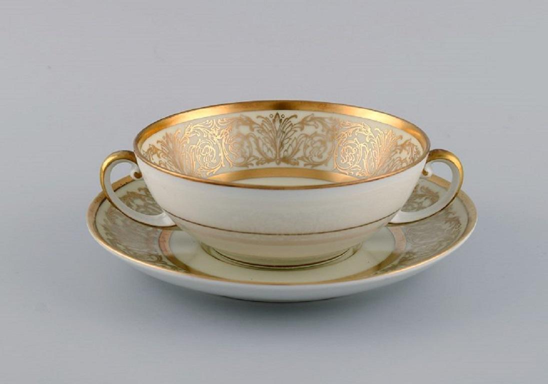 Tirschenreuth, Germany. 10 porcelain bouillon cups with saucers. 
Flowers and gold decoration. Mid-20th century.
The cup measures: 12 x 5 cm.
Saucer diameter: 16 cm.
In excellent condition.
Stamped.