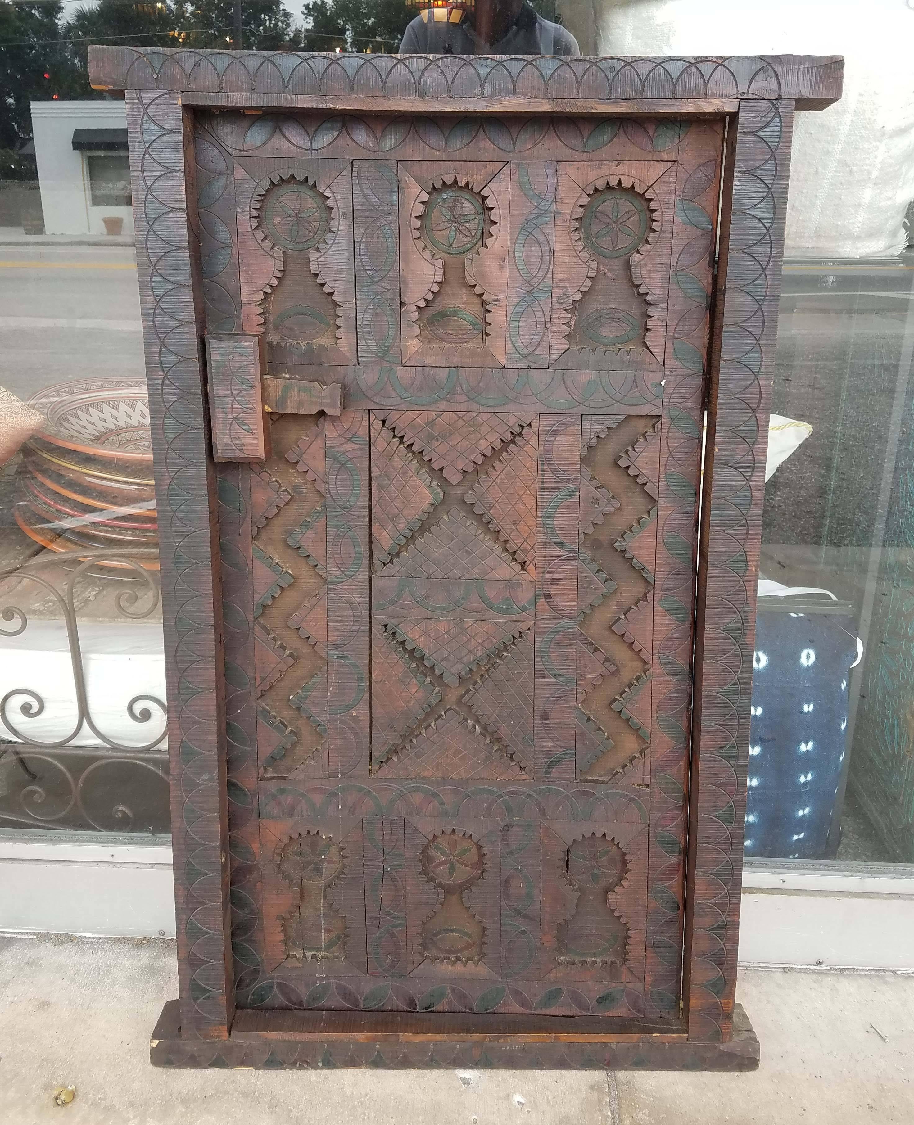 Very old and traditional Moroccan door or shutter. This door was taken from an old home in the Marrakech Medina when the house was being destroyed. Dimensions are approximately 48