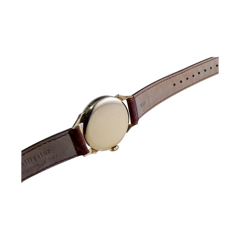 Tissot 14kt. Armbanduhr aus massivem Gold mit drei Datumsanzeigen, ca. 1940er Jahre 11