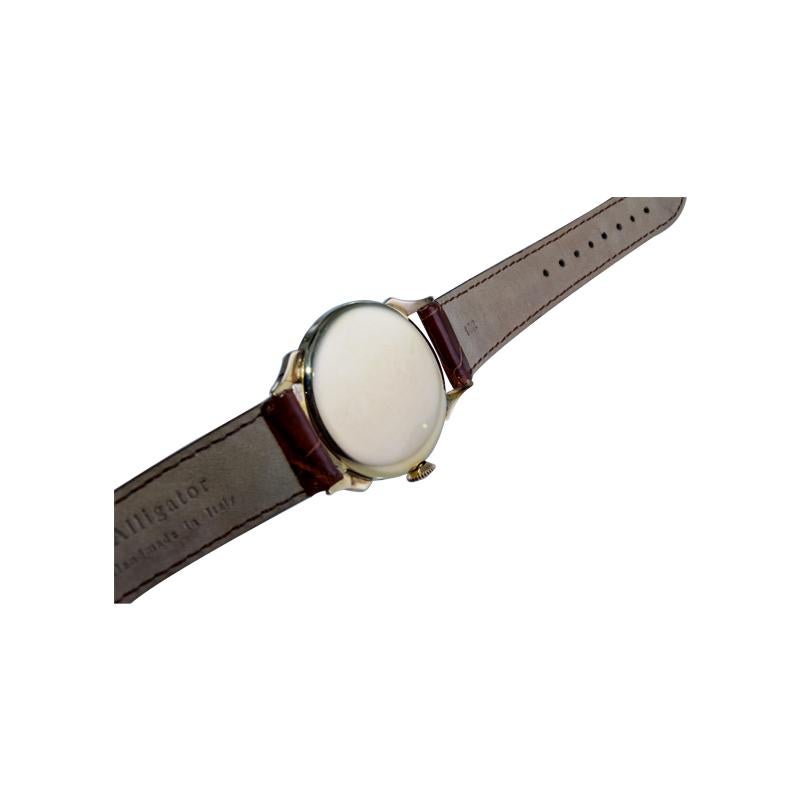 Tissot 14kt. Armbanduhr aus massivem Gold mit drei Datumsanzeigen, ca. 1940er Jahre 12