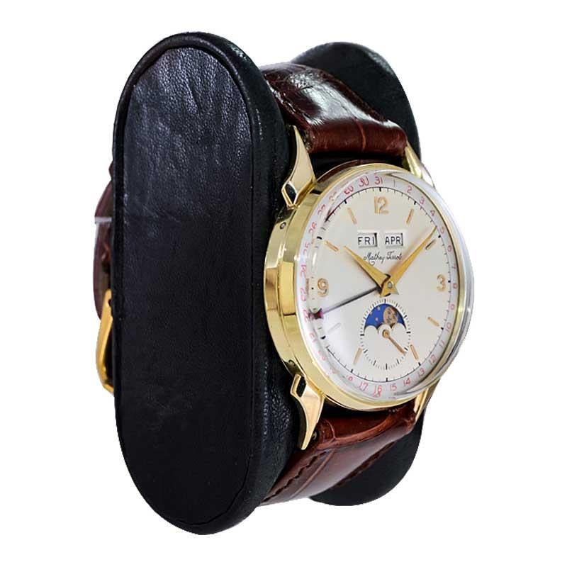 Tissot 14kt. Armbanduhr aus massivem Gold mit drei Datumsanzeigen, ca. 1940er Jahre (Art déco)