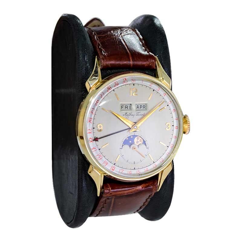 Tissot 14kt. Armbanduhr aus massivem Gold mit drei Datumsanzeigen, ca. 1940er Jahre für Damen oder Herren