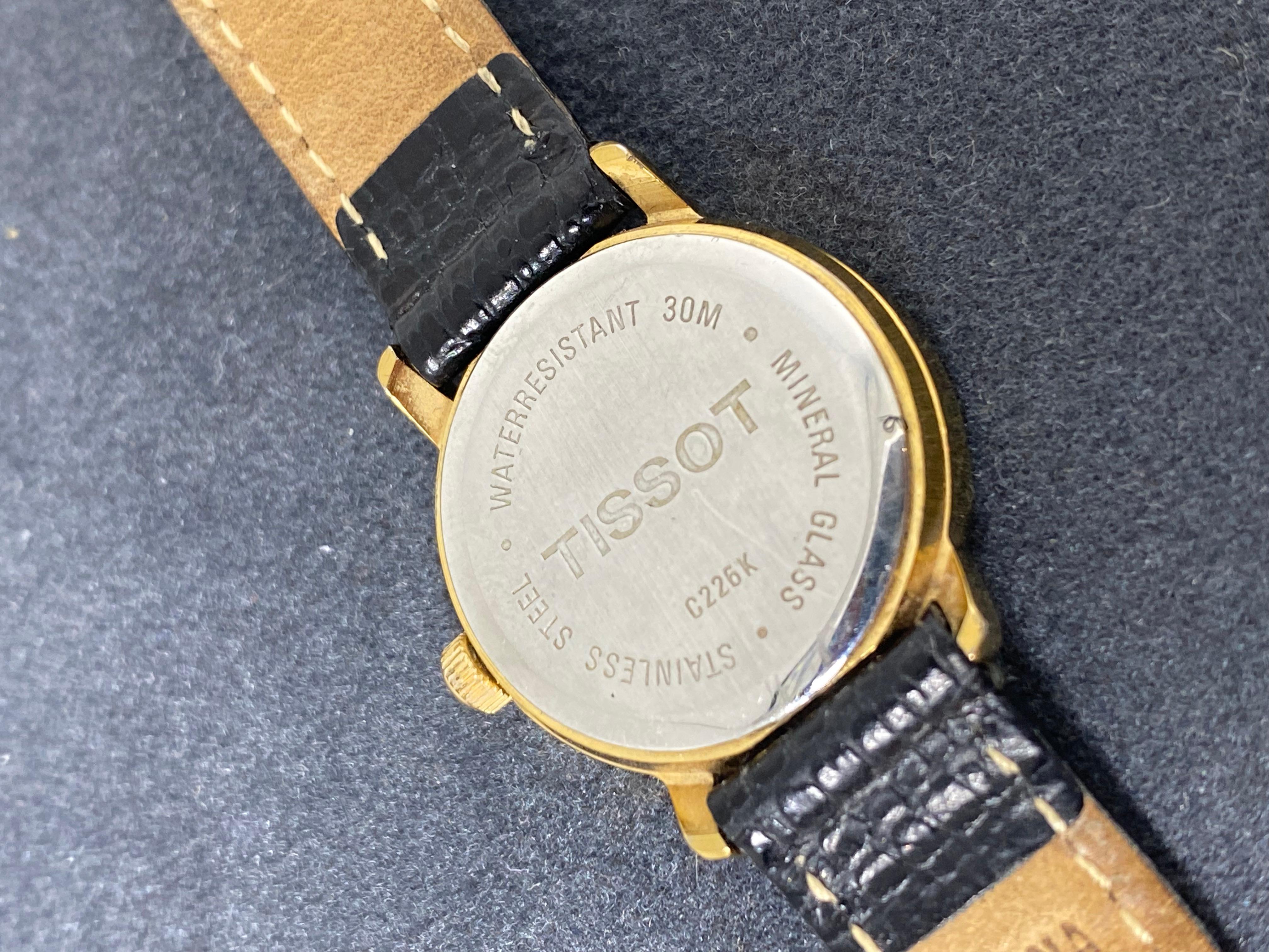 tissot gold watch