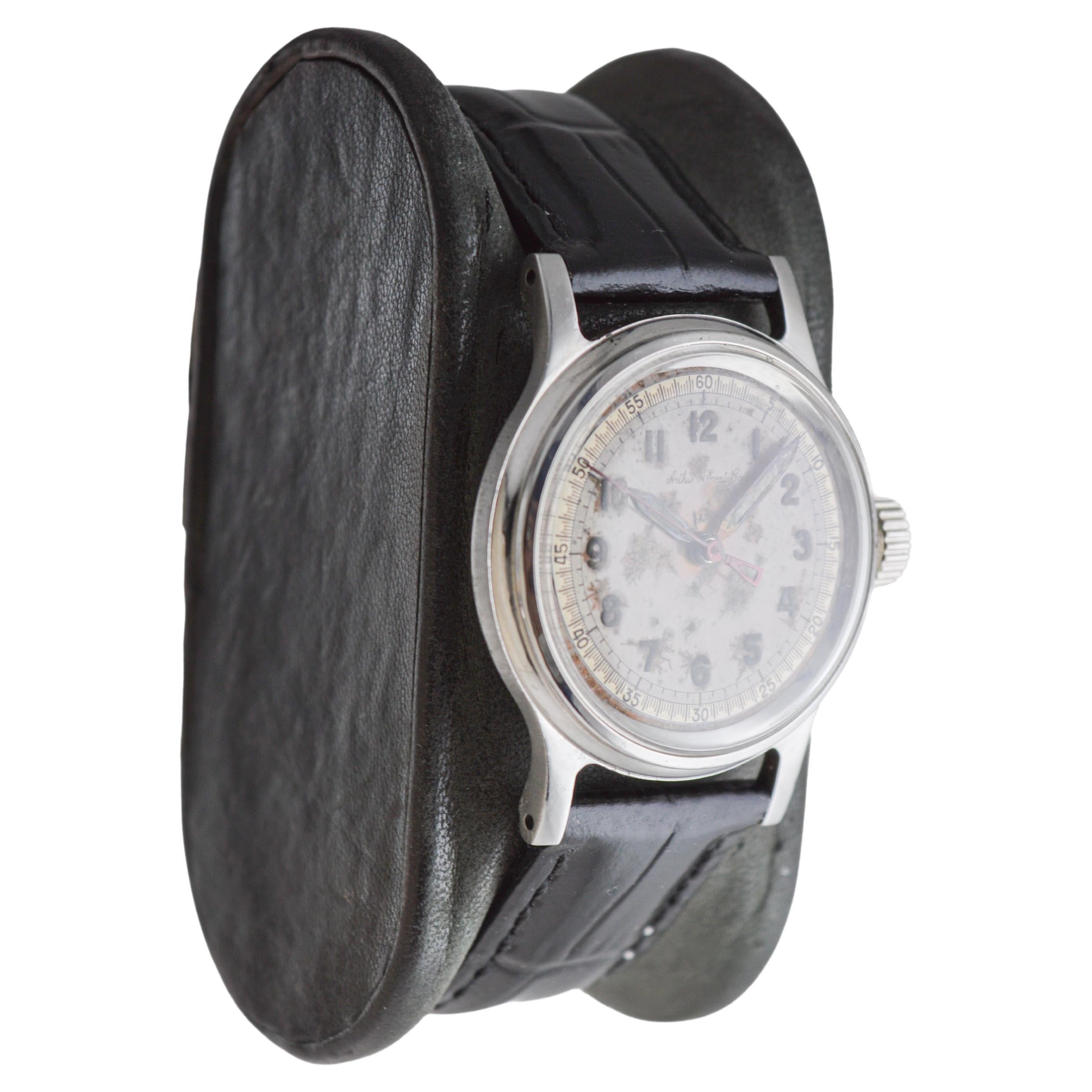 FACTORY / HOUSE: Tissot Watch Company
STYLE / REFERENCE: Multifort / Round Style
METAL / MATERIAL: Stainless Steel
CIRCA / YEAR: 1940's
DIMENSIONS / SIZE: Length 37mm X Diameter 30mm
MOVEMENT / CALIBER: Manual Winding / 17 Jewels  
DIAL / HANDS: