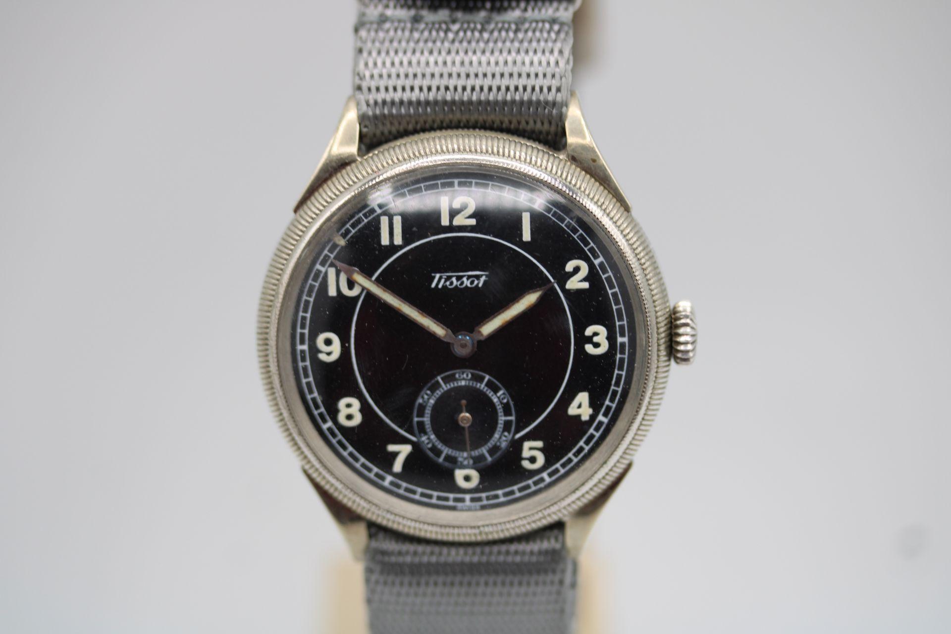 A rare 1930's Czech Military Tissot subsidiary seconds operating from a Cal.27 movement this manual wind watch is a difficult one to find. 

Oversize steel 39mm case with rotating bezel made by Tissot in Switzerland around 1938.

Case type: 3-body,