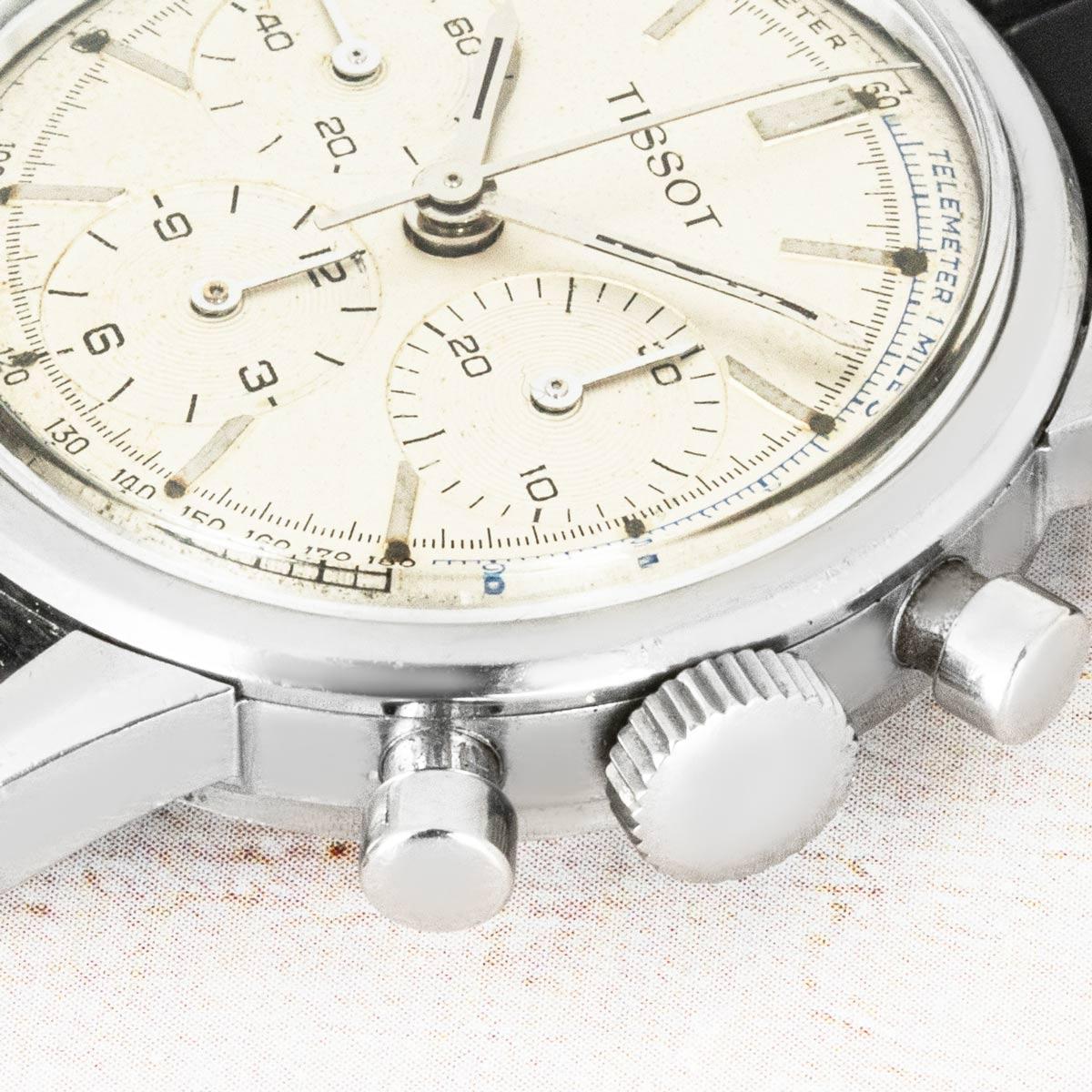 A vintage 34mm stainless steel chronograph by Tissot. Features a silver dial with a tachymeter scale, the three chronograph counters, and pushers. Fitted with plastic glass and a manual wind chronograph movement. This timepiece comes with a new