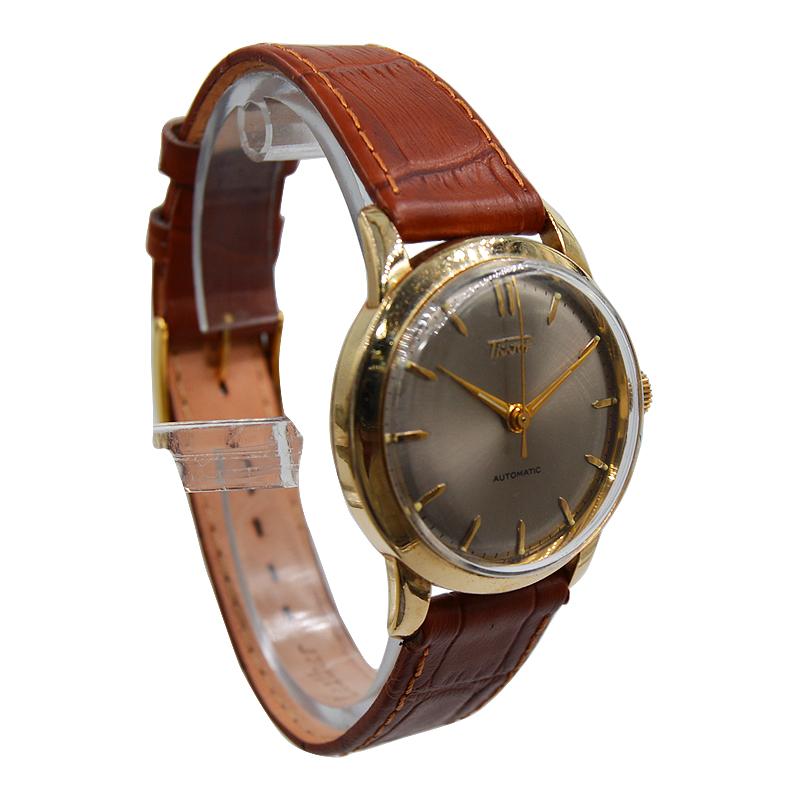 FACTORY / HOUSE: Tissot
STYLE / REFERENCE: Dress Round
METAL / MATERIAL: Yellow Gold Filled
CIRCA / YEAR: 1950's
DIMENSIONS / SIZE: 40mm X 34mm
MOVEMENT / CALIBER: Automatic Winding 
DIAL / HANDS: Original 
Brushed Silver/ Applied Straight Batons