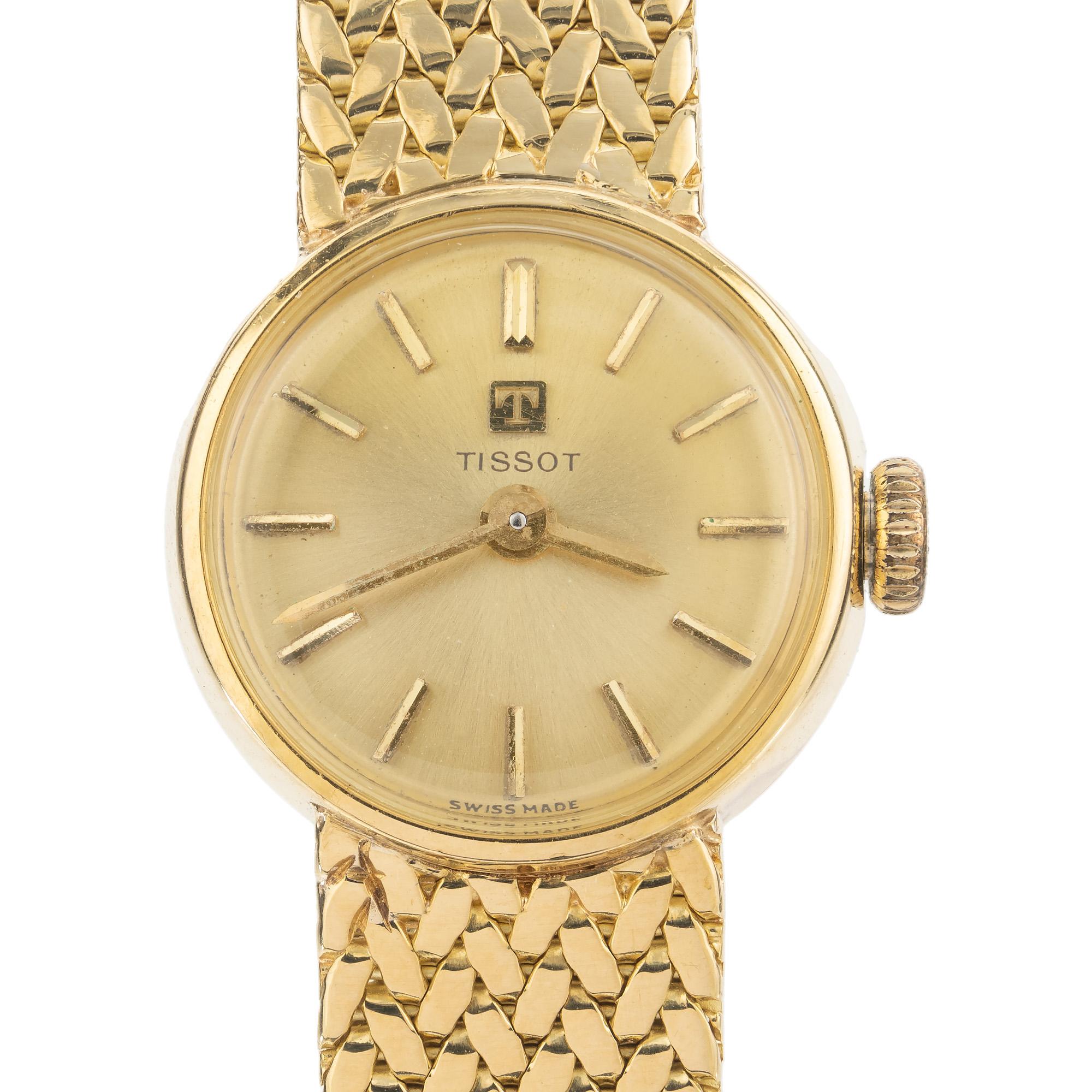 1980's Tissot yellow gold 17 jewel Ladies wristwatch is an exquisite timepiece that perfectly combines elegance and functionality. The yellow gold-tone dial boasts a minimalist aesthetic, with slim hour markers and luminous hands that make it easy