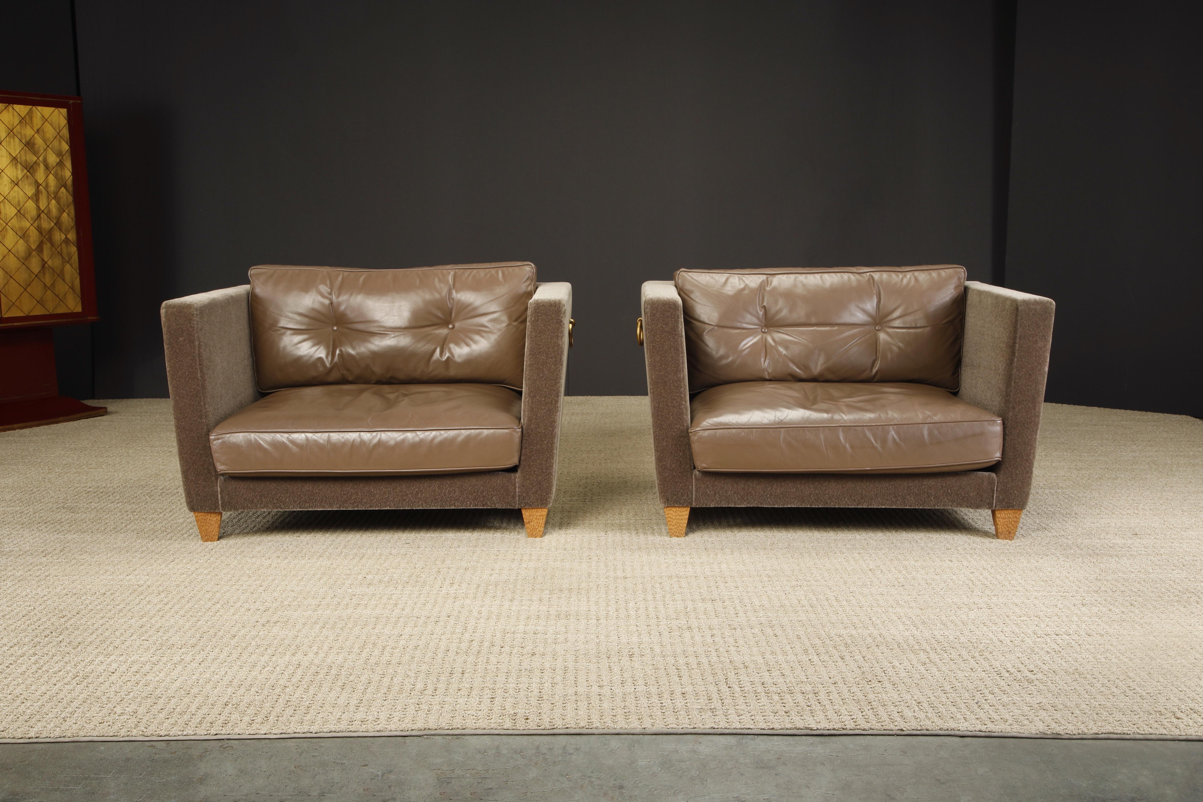 The pinnacle of luxury in size and materials, this pair of oversized 'Titan' club chairs by famed French designer Olivier Gagnère featuring luxurious mohair, supple very-high-quality-leather, chip-carved oak legs, and gilt bronze accent handles.