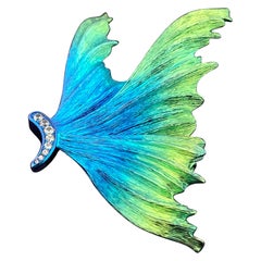 Broche de titanio y diamantes - Forma de ala / pájaro volador azul y verde iridiscente
