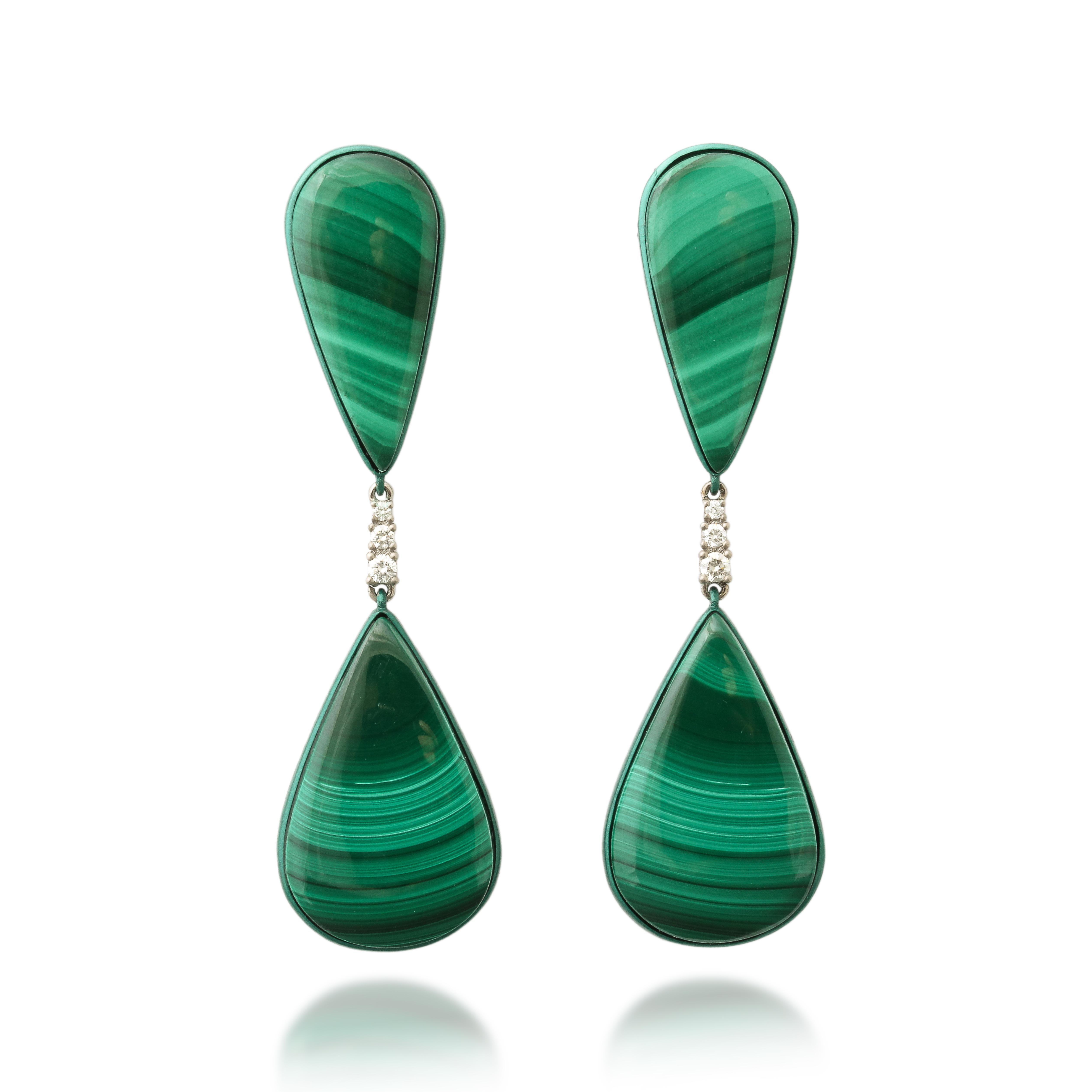 Embark on a journey of enchantment with these captivating malachite and diamond earrings, meticulously crafted to evoke the mesmerizing beauty of the natural world. Nestled within lustrous green titanium settings, the vibrant hues of malachite are