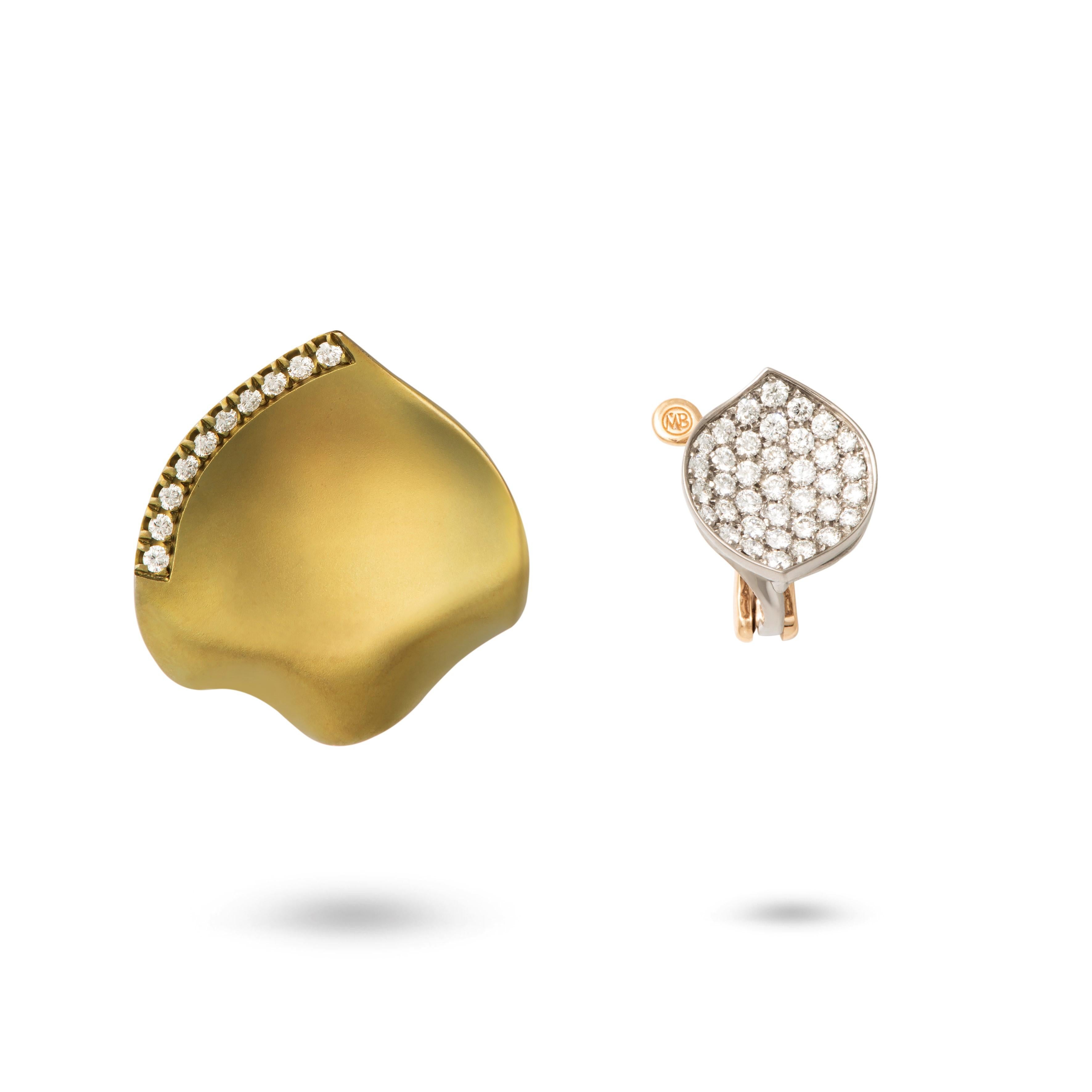 The iconic Margherita Burgener Petal earrings in a double wear version. Handmade in titanium, they are extremely light.
The lobe petal is natural grey titanium color, and it is diamond pavé set, while the gold color titanium bigger petal, set with a