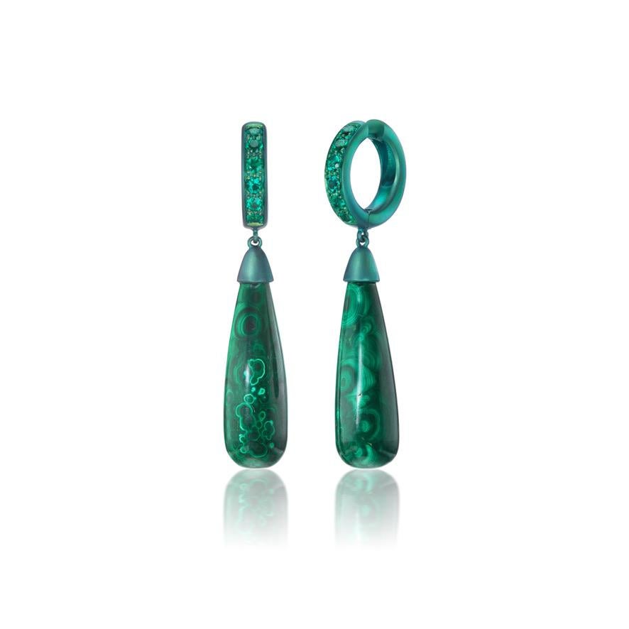 Indulge in the luxurious allure of nature's verdant splendor with these exquisite anodized green titanium Hoops. Delicately crafted to capture the essence of opulence, these hoops boast a stunning fusion of green hues, harmoniously blending into a