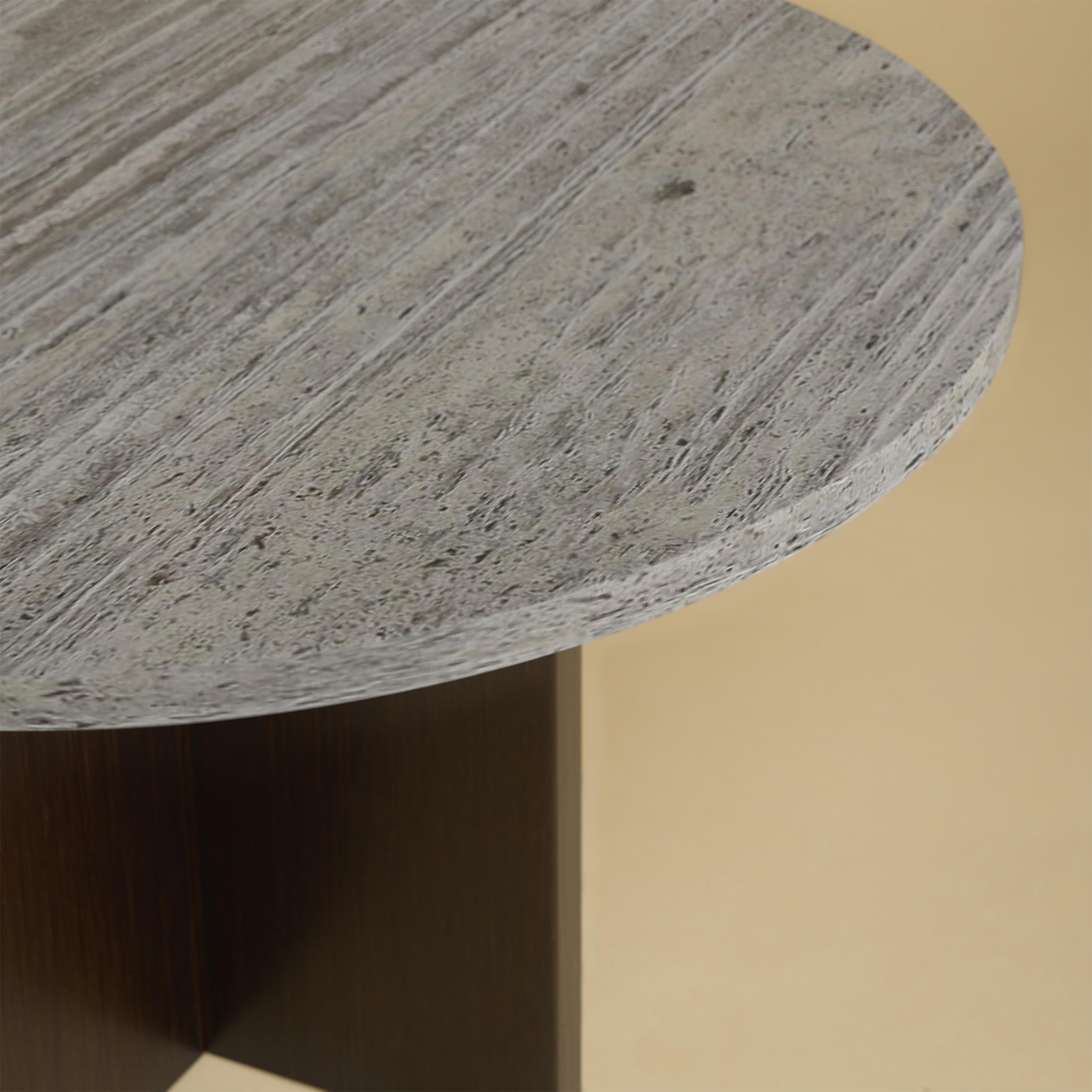 The Tinian coffee table is produced with an oak wood base and Titanium travertine top. The top is circular and 60cm in diameter, while the base is obtained by gluing oak planks perpendicular to each other.
Artisanal production made of technological