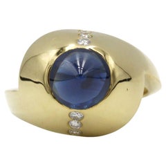 Title: 1970s 18K Yellow Gold Cone Sapphire Ring with Diamond Accents