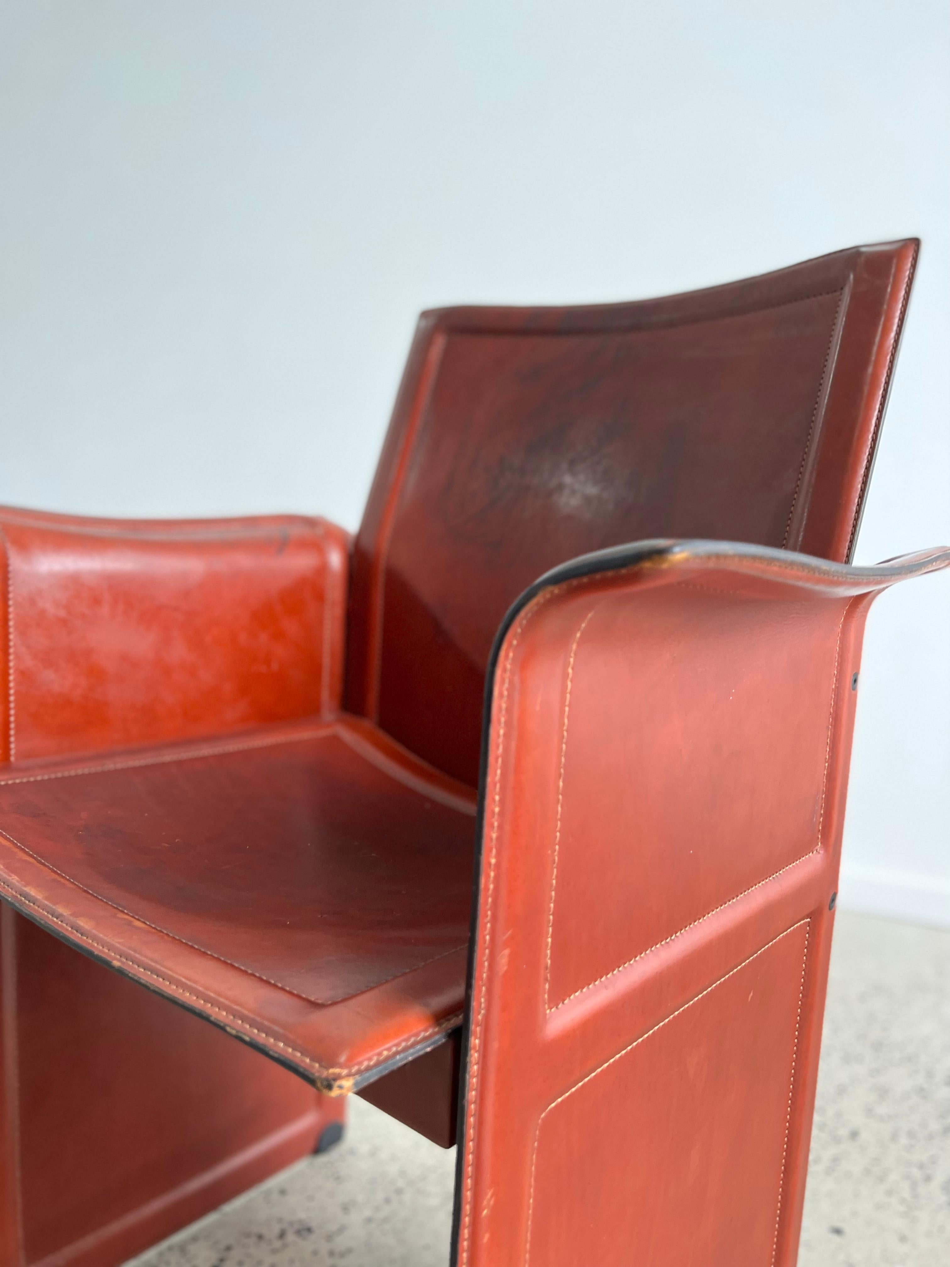 Leather armchair Korium Tito Agnoli for Matteo Grassi. Sophisticated, stylish and very comfortable is this Korium full leather arm chair which was designed by Tito Agnoli in the 1970s.
Nice patina on leather.
 Both chairs are signed.