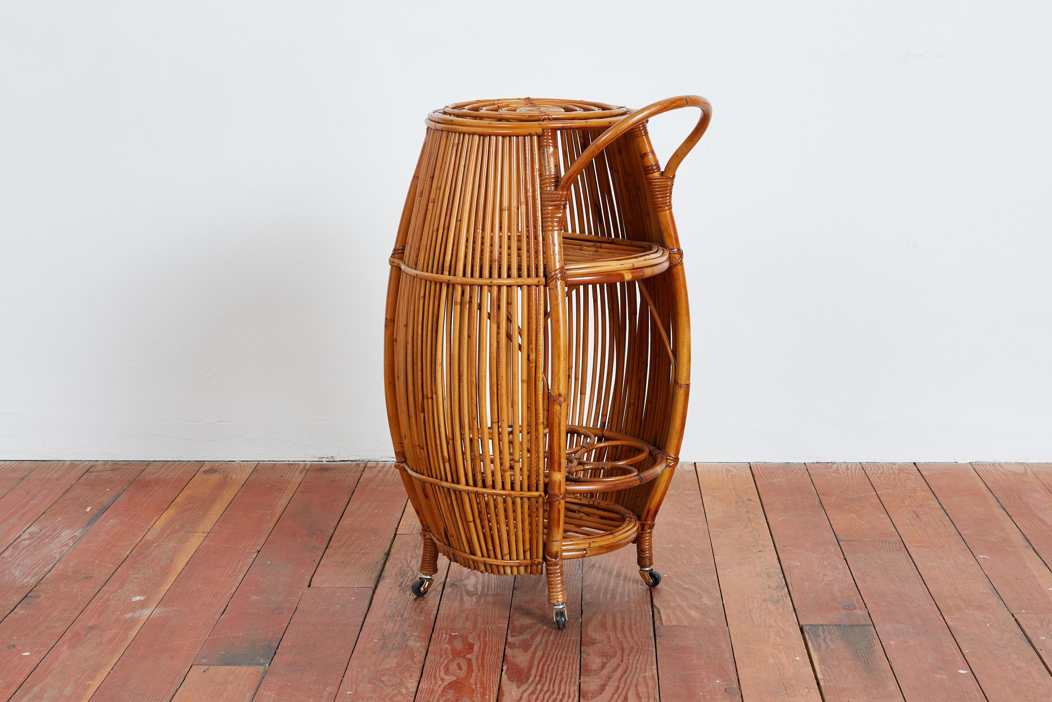 Unique Italian bamboo bar cart by Tito Agnoli 
Great shape with brass caster and 2 shelves 
Italy, 1950s
