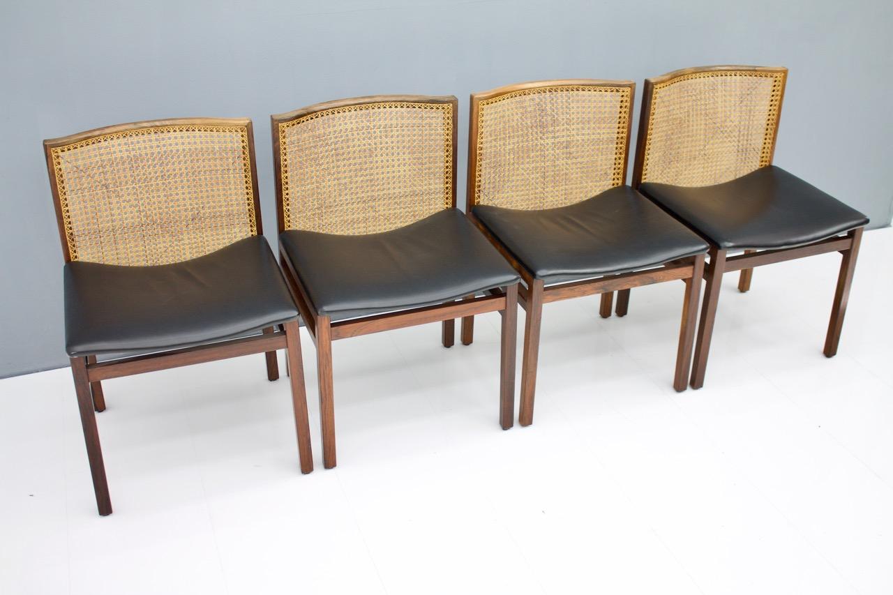 Rare set of four dining room chairs by Tito Agnoli from Italy 1960s. Wood, black leather and cane.
We have a second set of four chairs in stock.
Very good condition.